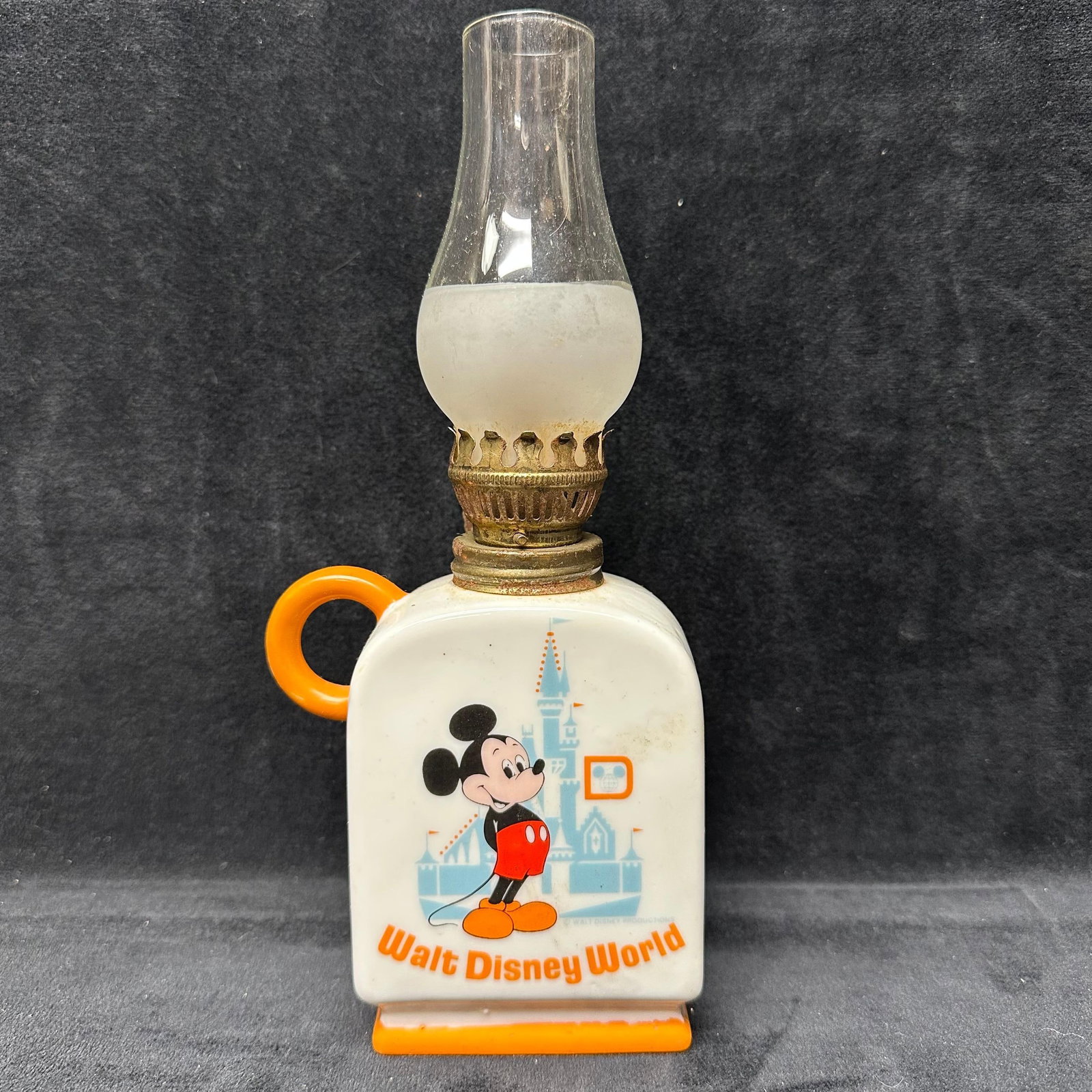 Walt Disney Production Mickey Mouse Finger Oil Lamp Orange: Walt Disney Production Mickey Mouse Finger Oil Lamp Orange with a hallmark on the bottom, as well as an original tag. This item is in good pre-owned, previously displayed condition with light wear and
