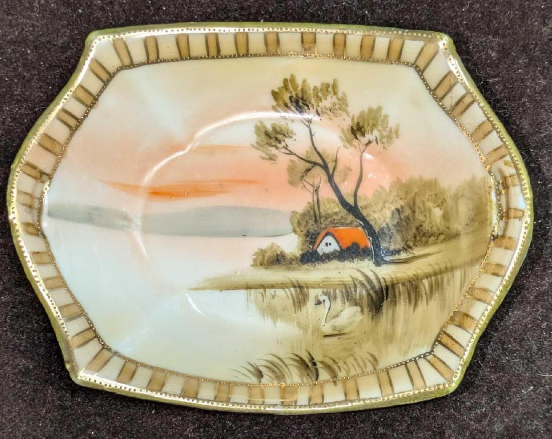 Vintage Hand Painted Porcelain Trinket Dish: Vintage Hand Painted Porcelain Trinket Dish. It is marked "Hand Painted and Nippon" on the back. This trinket dish is approx 5" x 3 7/8" x 7/8" and it weighs 0.17lb. The dish has signs of light wear.