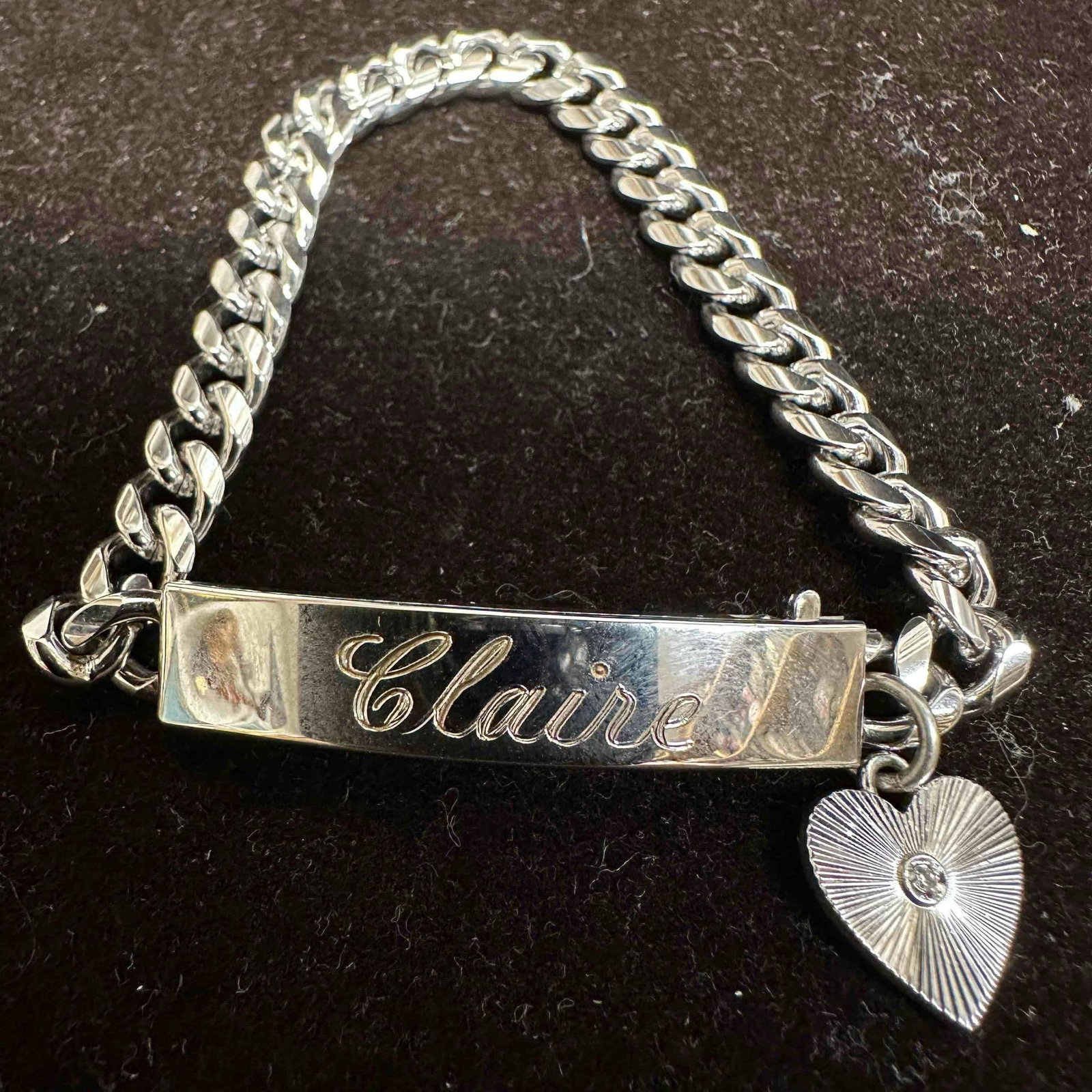 Claire Sterling Heart Charm Rhodium Electroplate ID Bracelet: This item is in good pre-owned, previously used/displayed condition with noticeable light wear, and surface scratches. Please reference all photos for full details. This piece of jewelry has been test