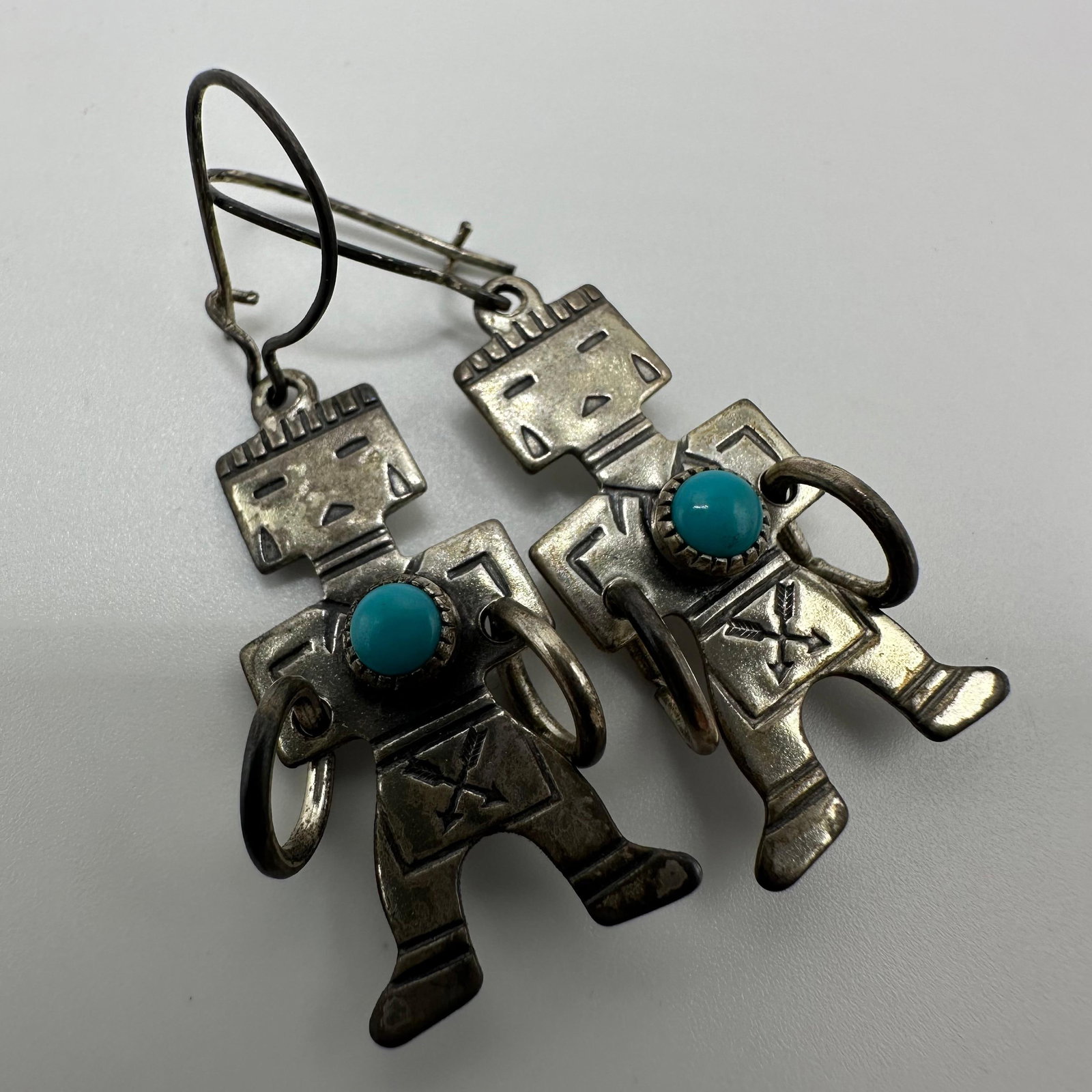 Kachina Dancer Native Style Turquoise Silver Earrings X98: This item is in good pre-owned, previously used/displayed condition with noticeable light wear and surface scratches. Please reference all photos for full details. This piece of jewelry has been teste