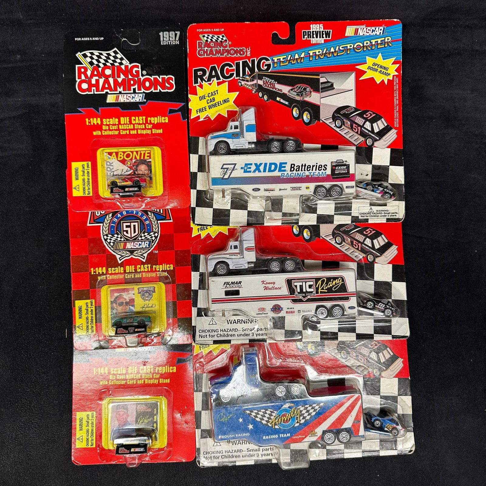 Racing Champions NASCAR Diecast Lot Team Transporters and 1:144 Scale Cars: A group of Racing Champions NASCAR die-cast collectibles, including both team transporter rigs and 1:144 scale stock cars. All items remain in original packaging. Packaging shows storage wear, includi