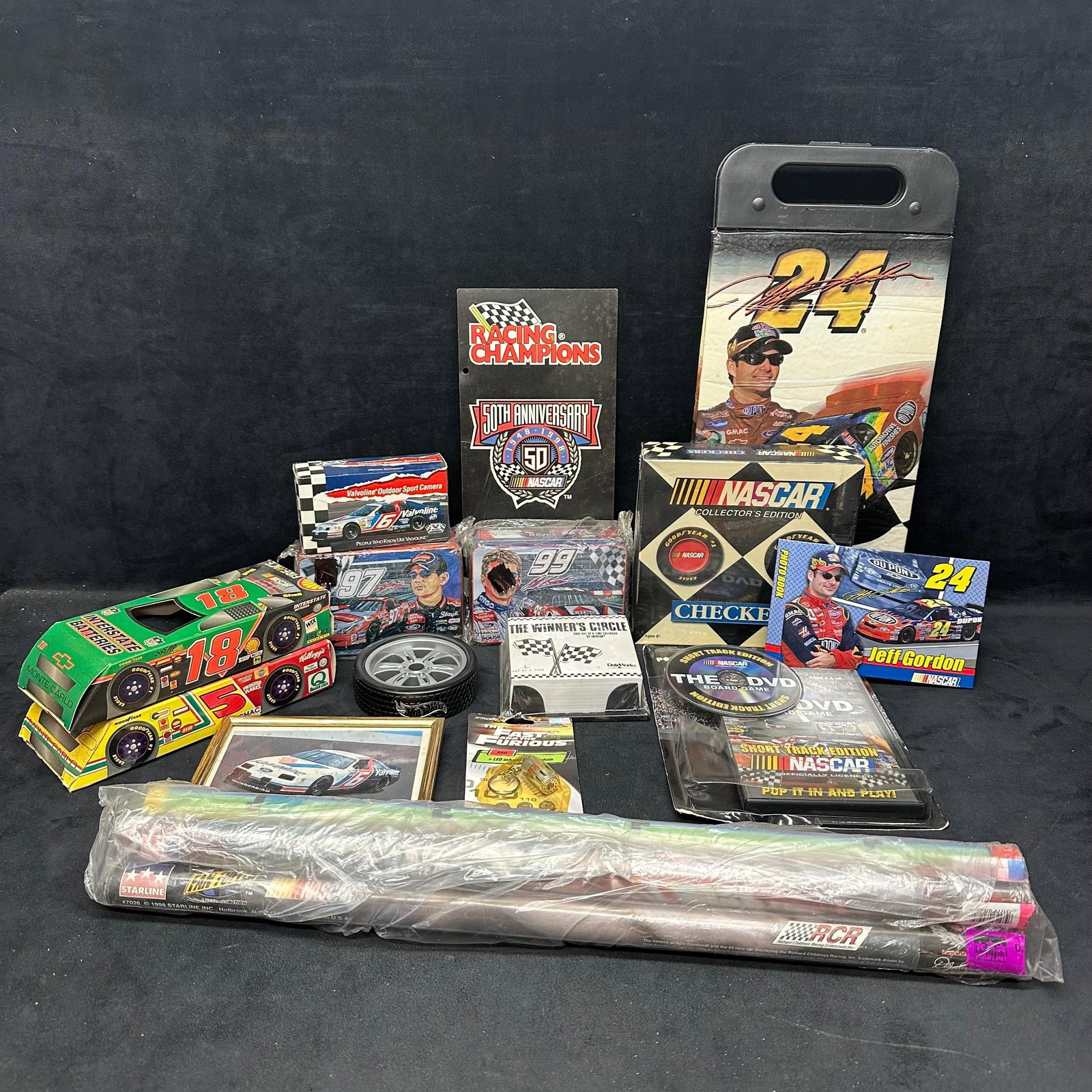 NASCAR Racing Collectibles Lot Jeff Gordon Dale Earnhardt Racing Champions Posters and More: Mixed lot of NASCAR collectibles featuring Jeff Gordon and Dale Earnhardt items, Racing Champions 50th Anniversary pieces, sealed souvenirs, collector cards, posters, framed photo print, Fast & Fu