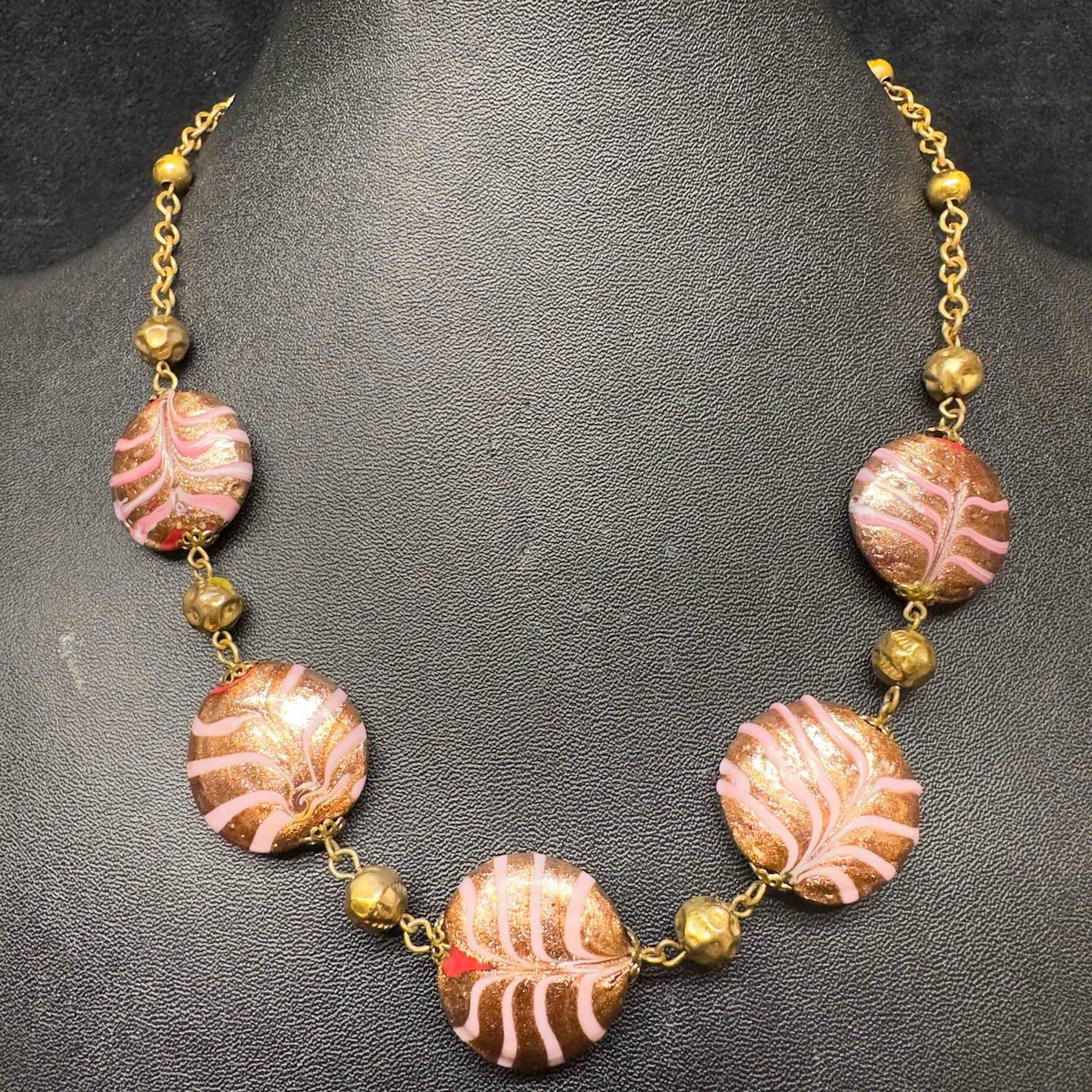 Murano Venetian Lamp Work Art Glass Pink Copper Red Circle Beaded Necklace C4: Murano Venetian Lamp Work Art Glass Pink Copper Red Circle Beaded Necklace C4. Necklace with red colored glass beads with beautiful hand painted designs on each. The necklace features copper and pink 