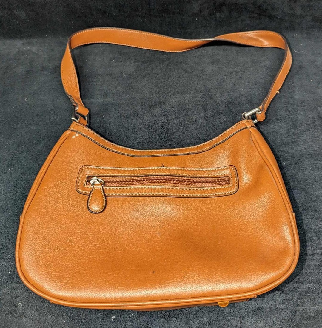 Liz Claiborne Brown Cognac Basic Essentials Purse: Liz Claiborne Brown Cognac Basic Essentials Purse. Made of faux leather. It has a short strap & side pockets and is approx 10 3/4" x 3" x 8" and it weighs 0.93lb. The purse has some markings and