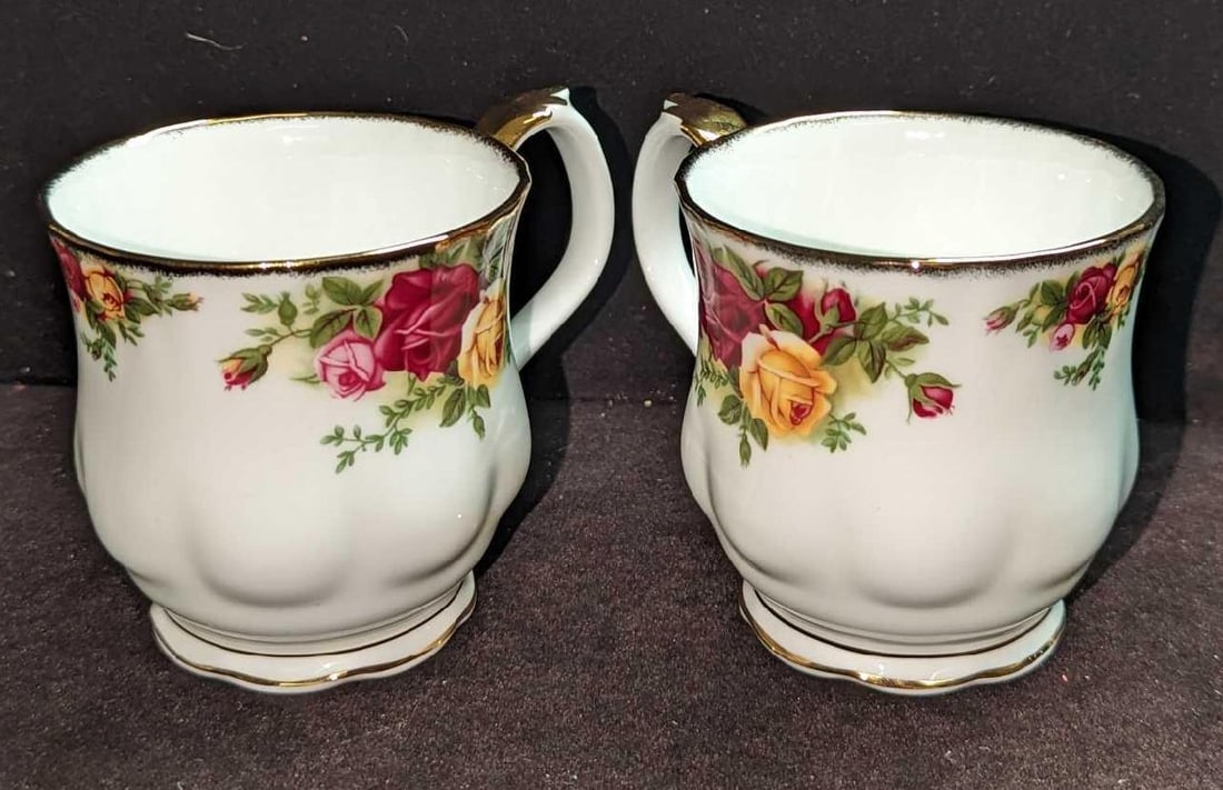 2 Royal Albert Old Country Roses Scalloped Coffee Mugs D: 2 Royal Albert Old Country Roses Scalloped Coffee Mugs D. Each is approx 4 1/2" x 3 1/4" x3 3/8" and the total weight is 0.75lb. The cups have no chips or cracks.