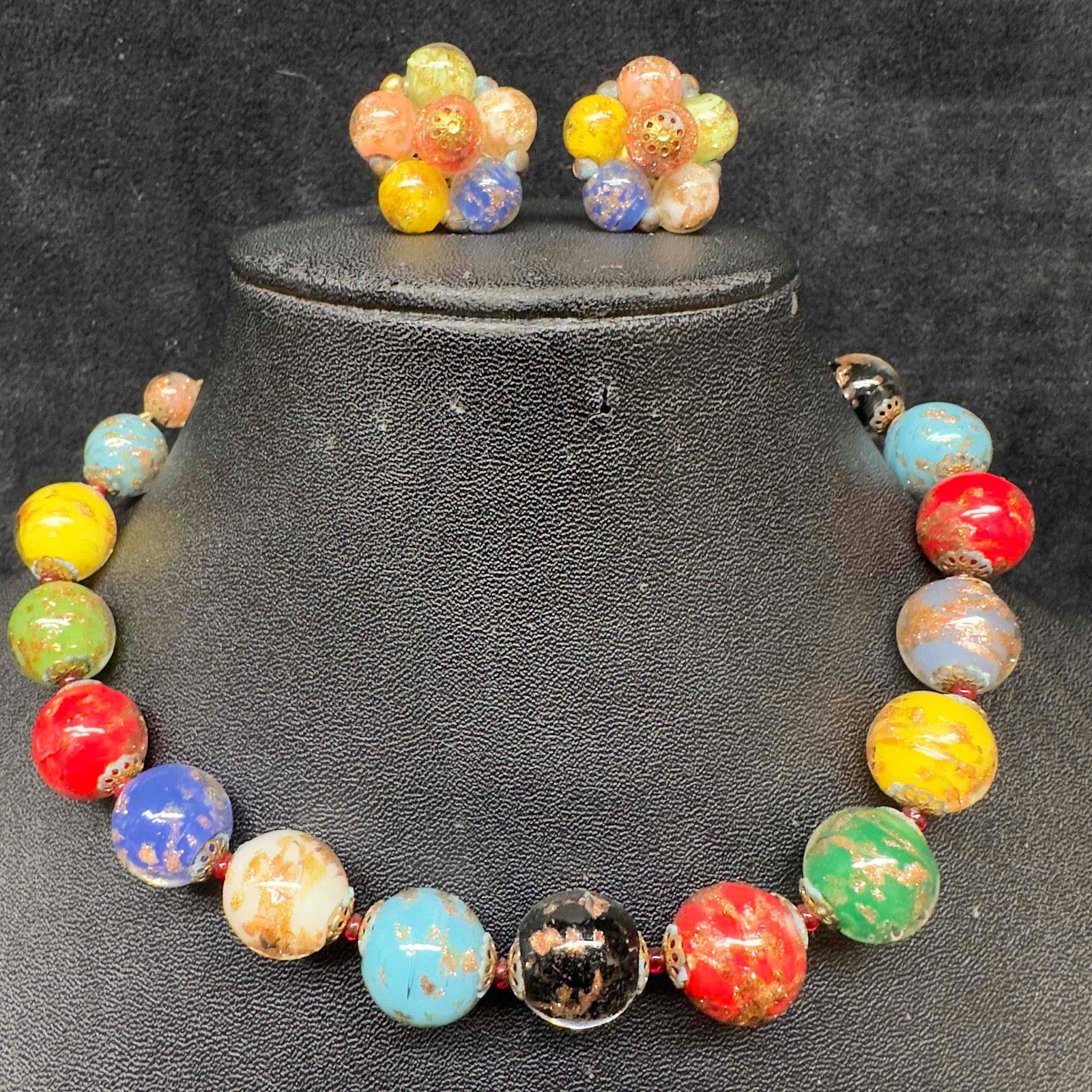 Murano Venetian Lamp Work Glass Multi Colored Round Bead Necklace and Copper Accent Earrings Set A42: Murano Venetian Lamp Work Glass Multi Colored Round Bead Necklace and Copper Accent Earrings Set A42. Necklace and earrings with multi colored glass beads with beautiful designs on each. The necklace 