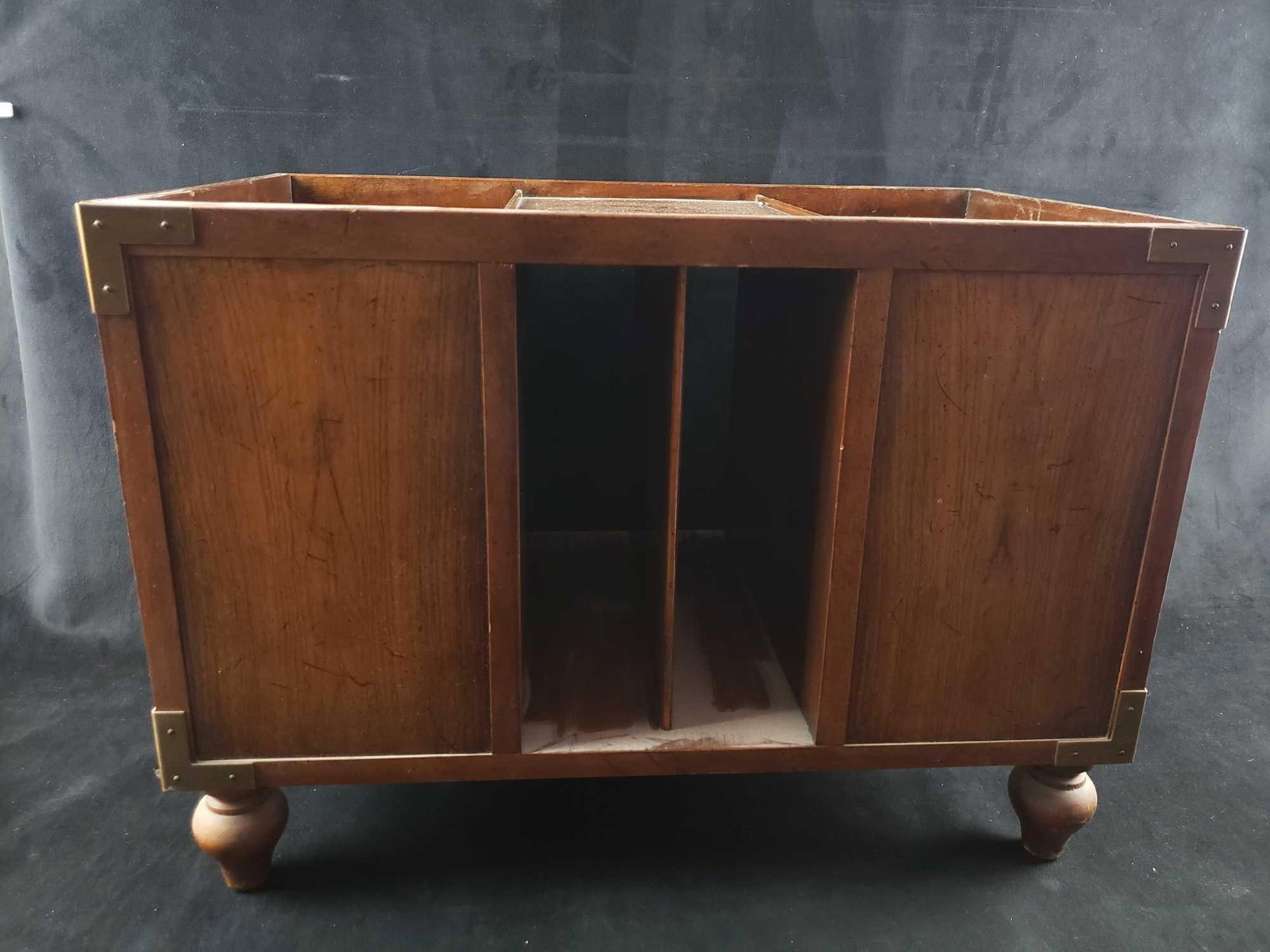 Wooden Footed Record or Magazine Rack: Wooden Footed Record or Magazine Rack. This magazine rack is in great used condition. The rack has a fair amount of dust on it and will need to be cleaned. The wood has some slight scratches from use 