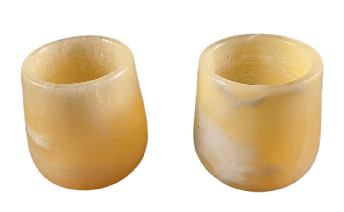 Two Vintage Soapstone Candle Holders: Two Vintage Soapstone Candle Holders. The maker and date of creation are unknown. The candle holders are approx 2 1/2" x 2 1/2" x 3 1/2" and together they weigh 2.03lbs. The candle holders are in a go