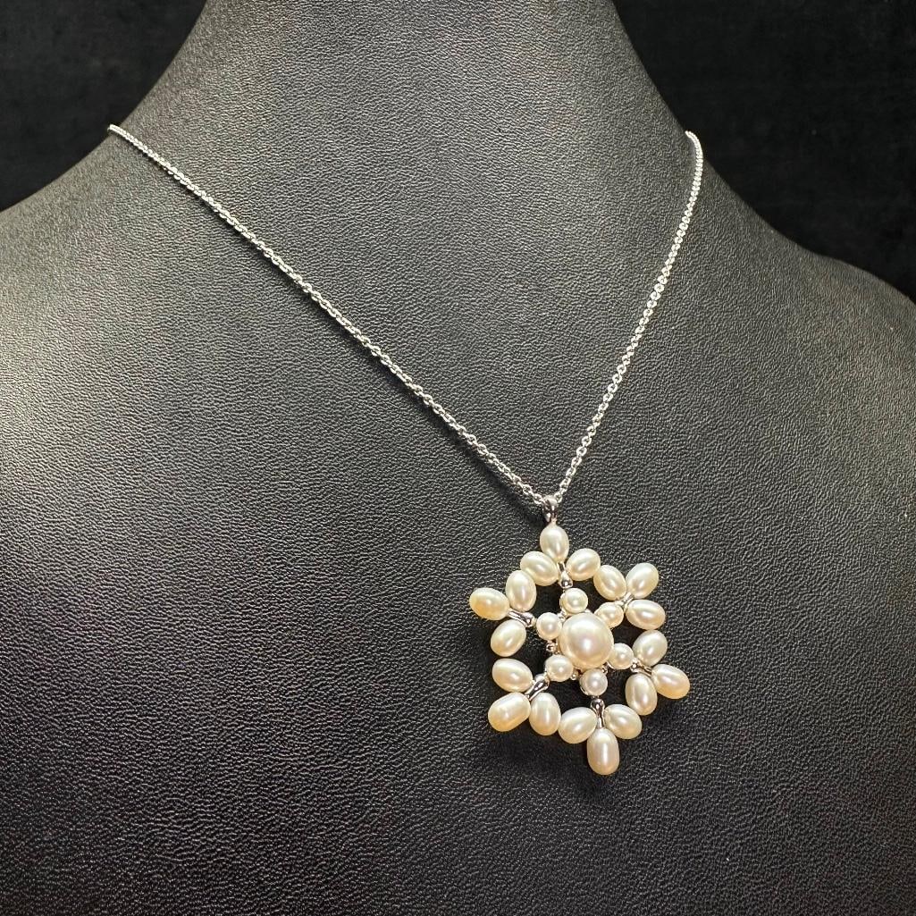 Sterling Silver Pearl Snowflake Pendant: This piece of jewelry has been tested and researched prior to listing. Please view all our pictures they are part of our description. DETAILS: Metal - Sterling Silver Color -Silver Stones - River Pear