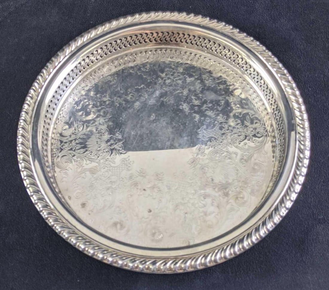Vintage Silver Plated Tray: Vintage Silver Plated Tray This is a W M Rodgers silver-plated smaller tray. This tray has little tarnish and is very shiny. There are stickers and a piece of tape on the back. Overall this is in good