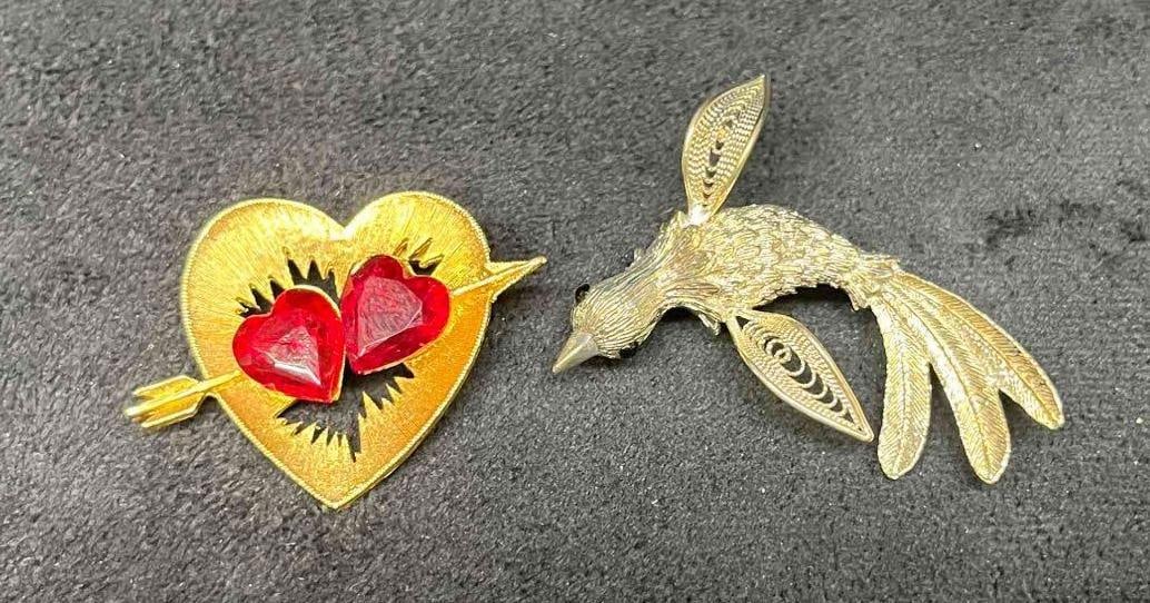 Two Vintage Signed J.J Brooches Heart and Bird: This lot contains Two Vintage Signed J.J Brooches Heart & Bird. The heart brooch is approx 1 1/4" x 1 3/4" x 1/2" while the bird brooch is approx 2" x 1 3/4" x 3/4". Total weight is approx 0.9oz. Over