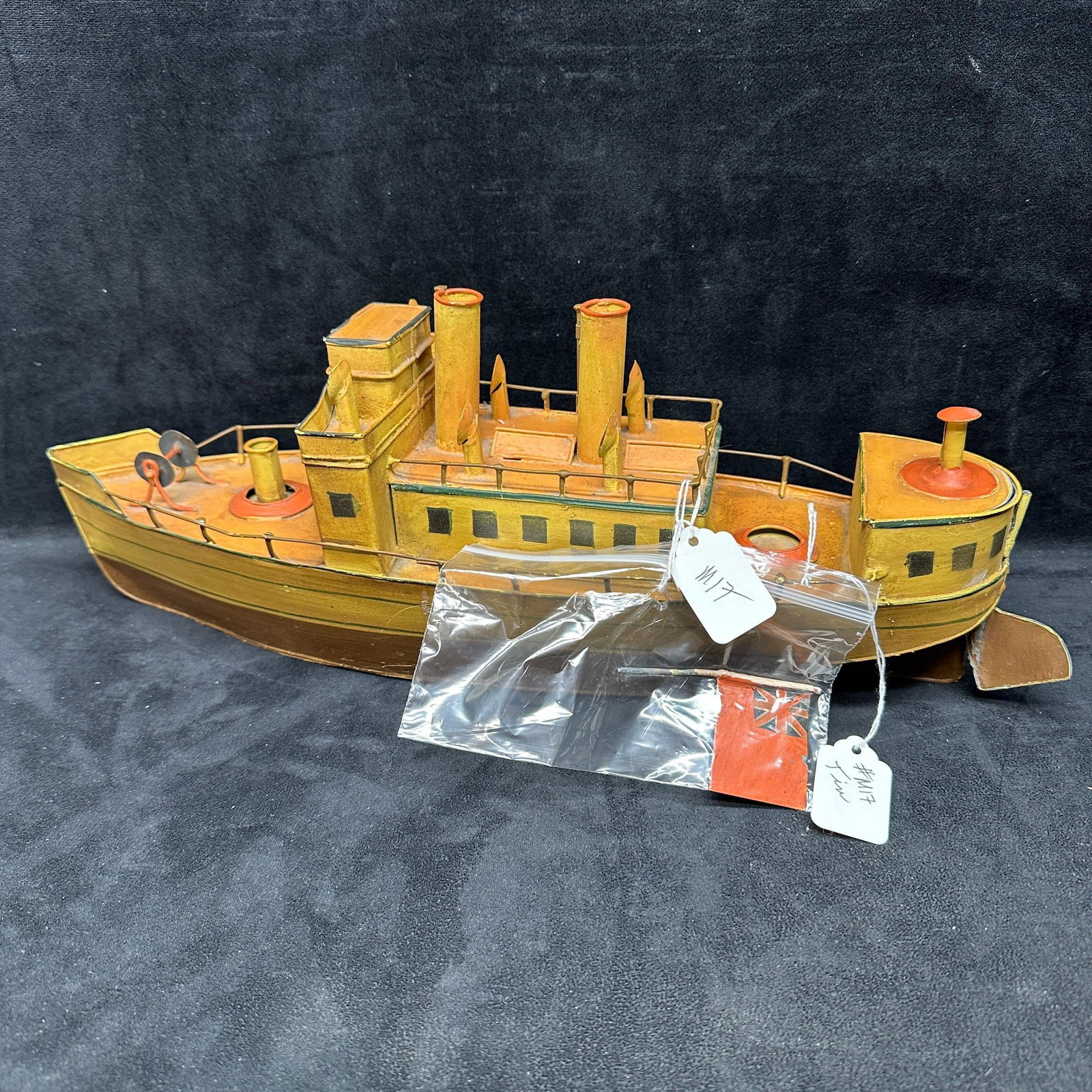 British Flag Tin Toy Steamship Hand Painted Boat Model: Vintage metal/tin toy steamship 18" model with British Flag. No hallmarks noticed. The flag has become loose. This item is in pre-owned, previously displayed condition with wear, noticeable tarnis