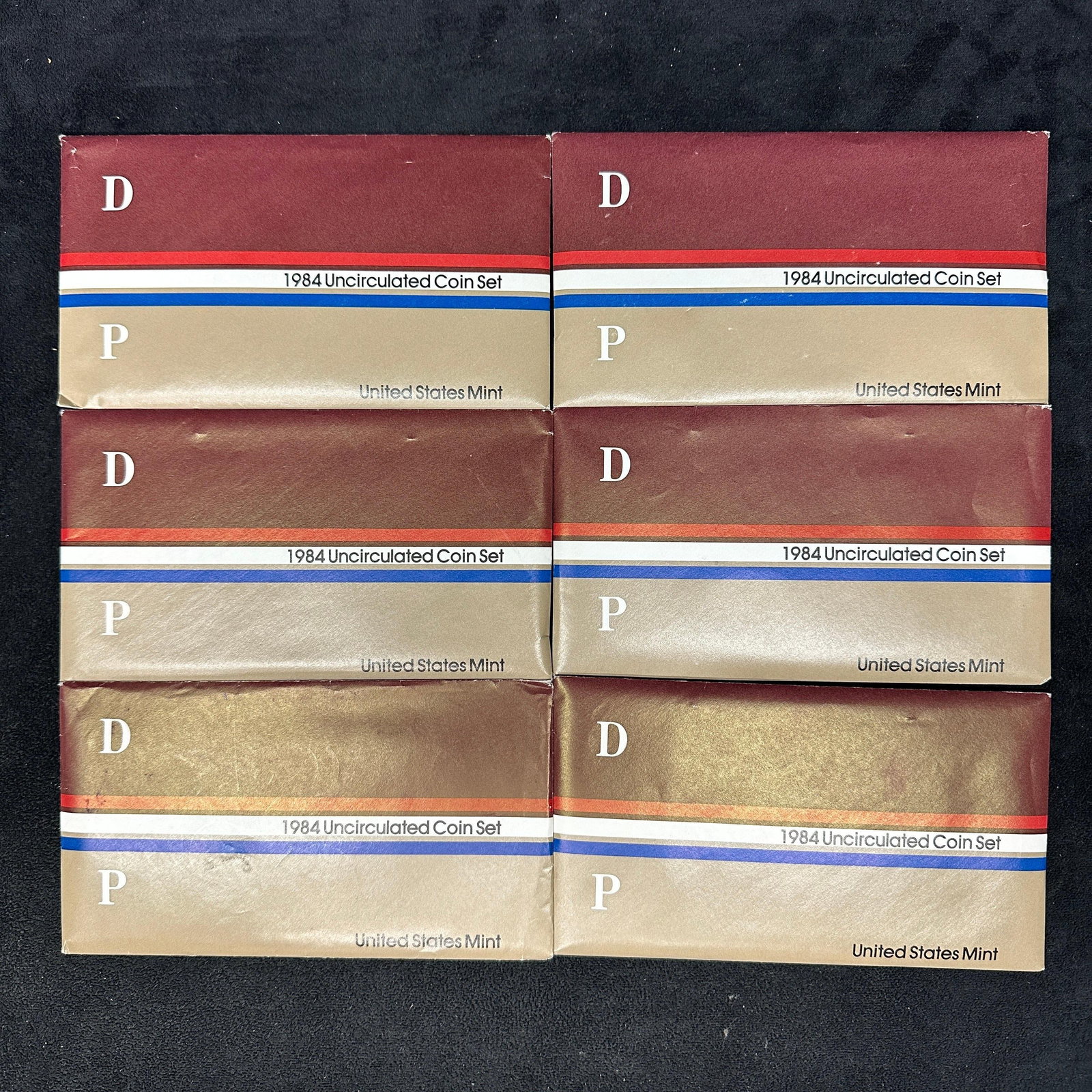 Six 1984 US Mint Uncirculated Coin Set D P: Each set contains 10 uncirculated coins; five from the Philadelphia Mint and five from the Denver Mint. The included coins are the Kennedy half dollar, Washington quarter, Roosevelt dime, Jefferson ni
