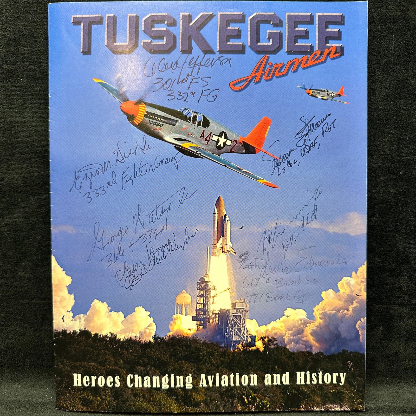 Tuskegee Airmen Signed Magazine Multiple Signatures Red Tail Project: Tuskegee Airmen commemorative booklet magazine titled “Heroes Changing Aviation and History” featuring multiple ink signatures from associated Tuskegee airmen across the front cover. Includes 