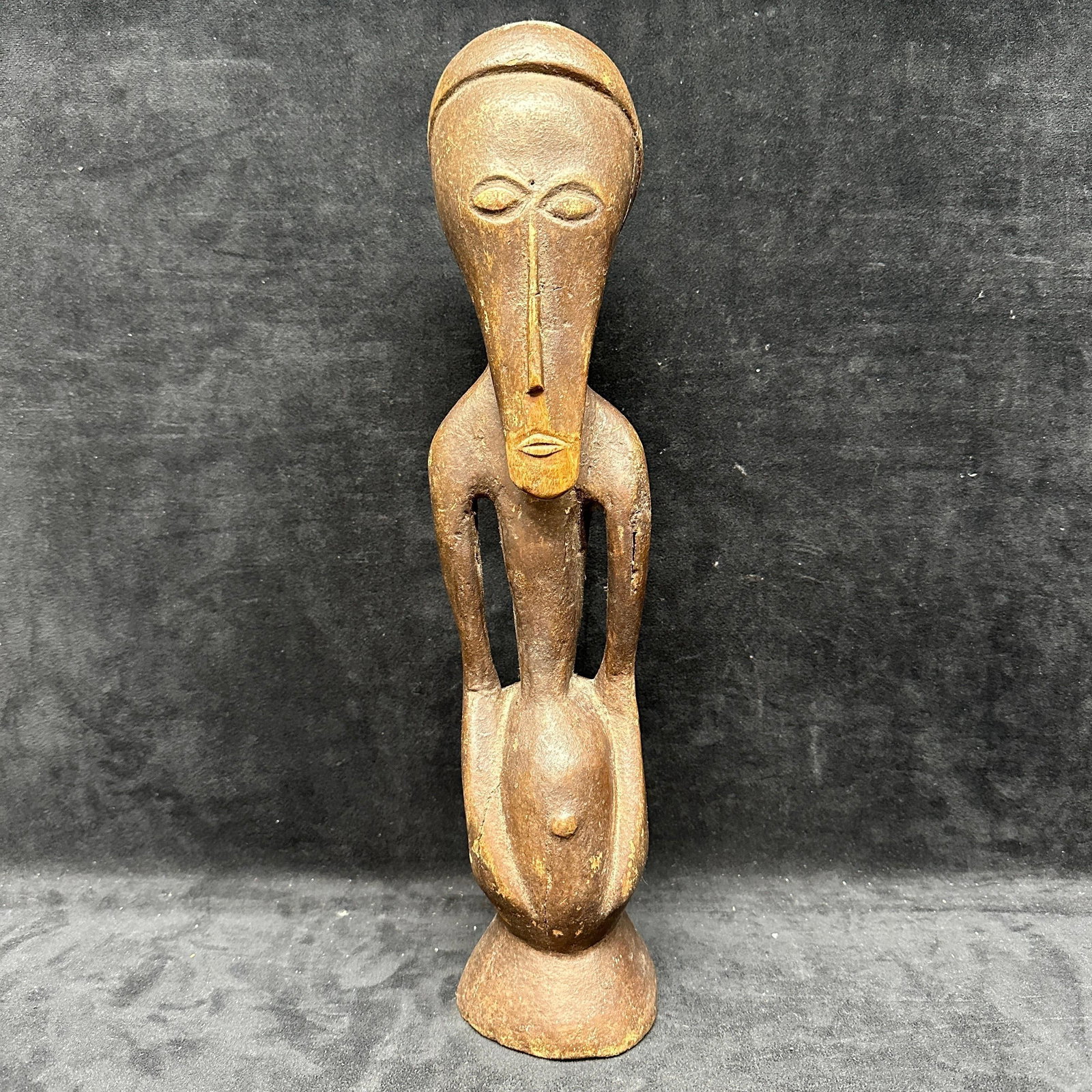 African Carved Wood Female Figure Nkisi Style Congo Power Figure Fetish: Carved wooden standing female figure in the style of Central African Nkisi or power figures, likely from the Congo region. Elongated facial features with incised eyes and long nose, arms resting along