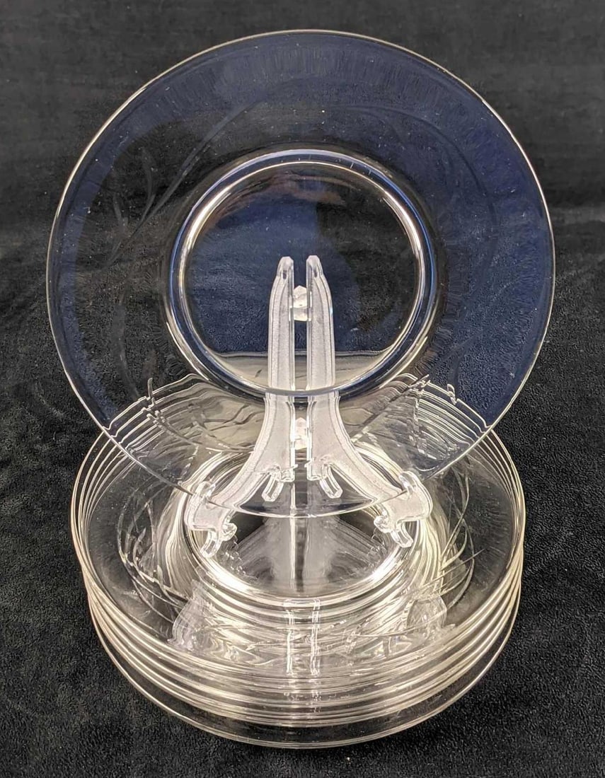 Seven Clear Glass Salad Plates: Seven Clear Glass Salad Plates. The maker and date of creation are unknown. Each plate is approx 8" and the set weighs 5.5lbs. Plates are all in a good, used condition with light wear and scratches. D