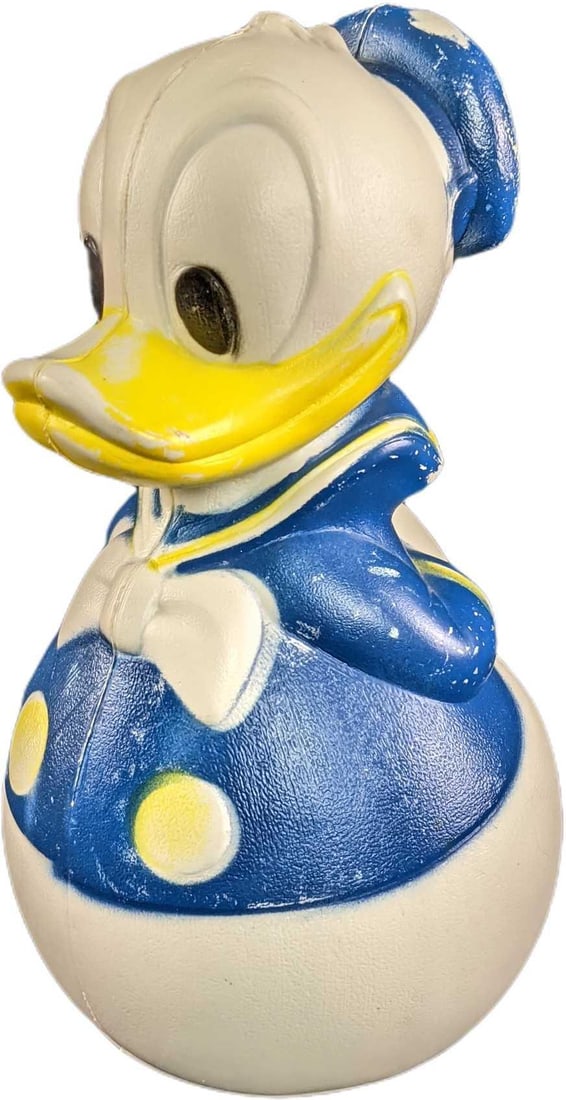 Vintage Roly Poly Tumbling Plastic Donald Duck Toy: Vintage Disney Roly Poly tumbling plastic Donald Duck toy. This toy is weighted in the bottom and no matter how you push on it, it gets right back up. It's in good used condition with moderate scuffin