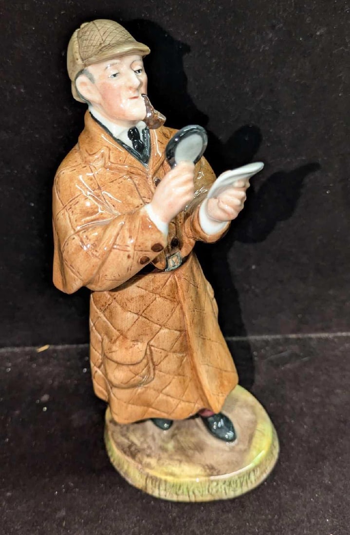 Retired Royal Doulton Detective Figurine: Retired Royal Doulton Detective Figurine. This figurine was released from the year 1977 to the year 1983 and it was designed by Mary Nicoll and was part of the 'Professions" series. This is appro