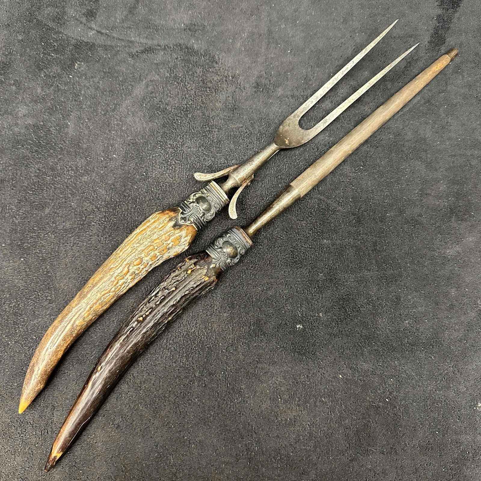 Two Piece Sterling Mounted Antler Carving Set Knife Sharpener and Fork: Each handle mount is marked Sterling. This item is in good pre-owned, previously displayed condition with light wear, and surface scratches. Please reference all photos for full details. Utensils: 13&