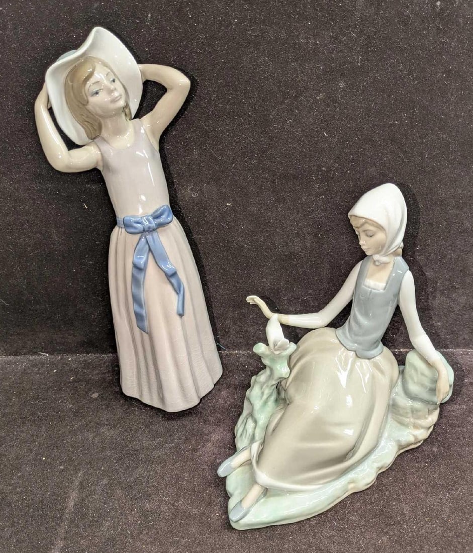 Retired Lladro Trying On A Straw Hat And Shepherdess with Dove: Retired Lladro Trying On A Straw Hat And Shepherdess with Dove. This lot includes: (1) Retired Lladro "Trying On A Straw Hat" #5011. This was designed by Francisco Catala. This is approx 3 1/2