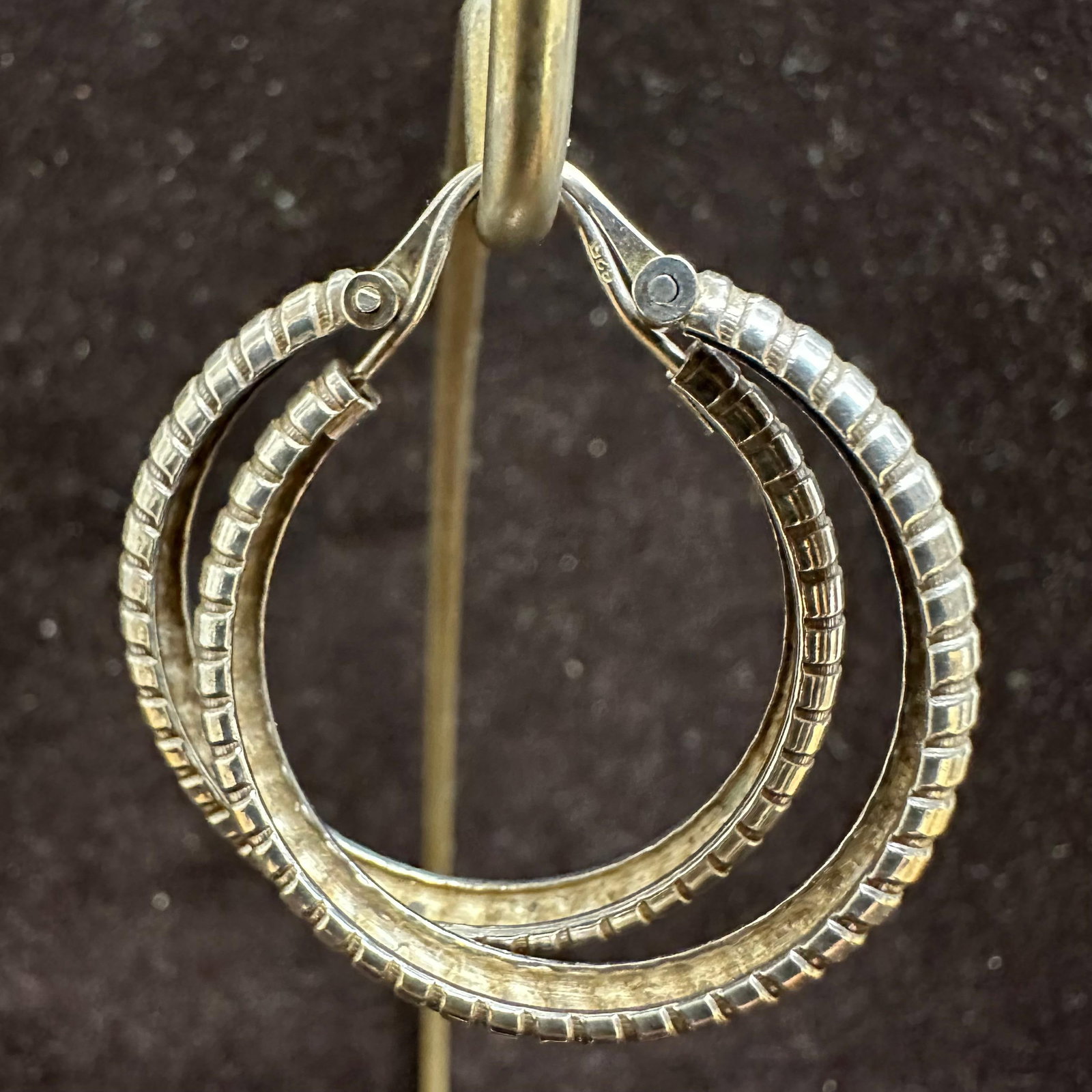 Pair of Ribbed Sterling Silver Hoop Earrings: This item is in good pre-owned, previously used/displayed condition with noticeable light wear and surface scratches. Please reference all photos for full details. This piece of jewelry has been