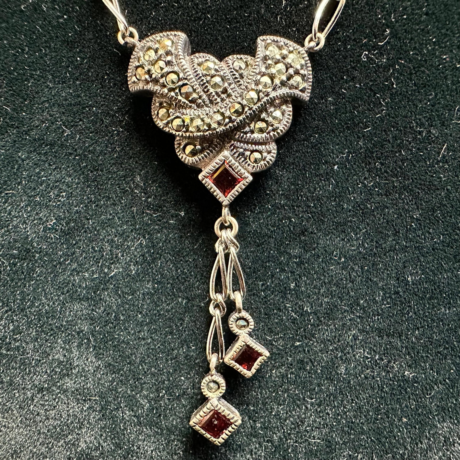 Red Garnet and Marcasite Stone Accent Sterling Silver 925 Necklace: This item is in good pre-owned, previously used/displayed condition with noticeable light wear and surface scratches. Please reference all photos for full details. This piece of jewelry has been teste