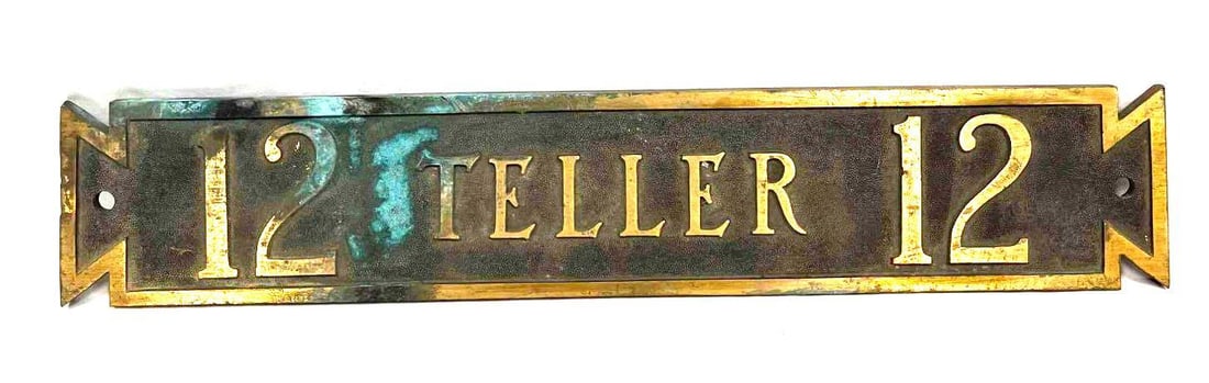 Vintage Brass Bank Teller Sign 12: This lot contains a Vintage Brass Bank Teller Sign 12. The sign is approx 16 3/4" x 3 1/4" x 1/2" and it weighs 3.6lbs. Overall the sign is in good used condition with some light wear from use