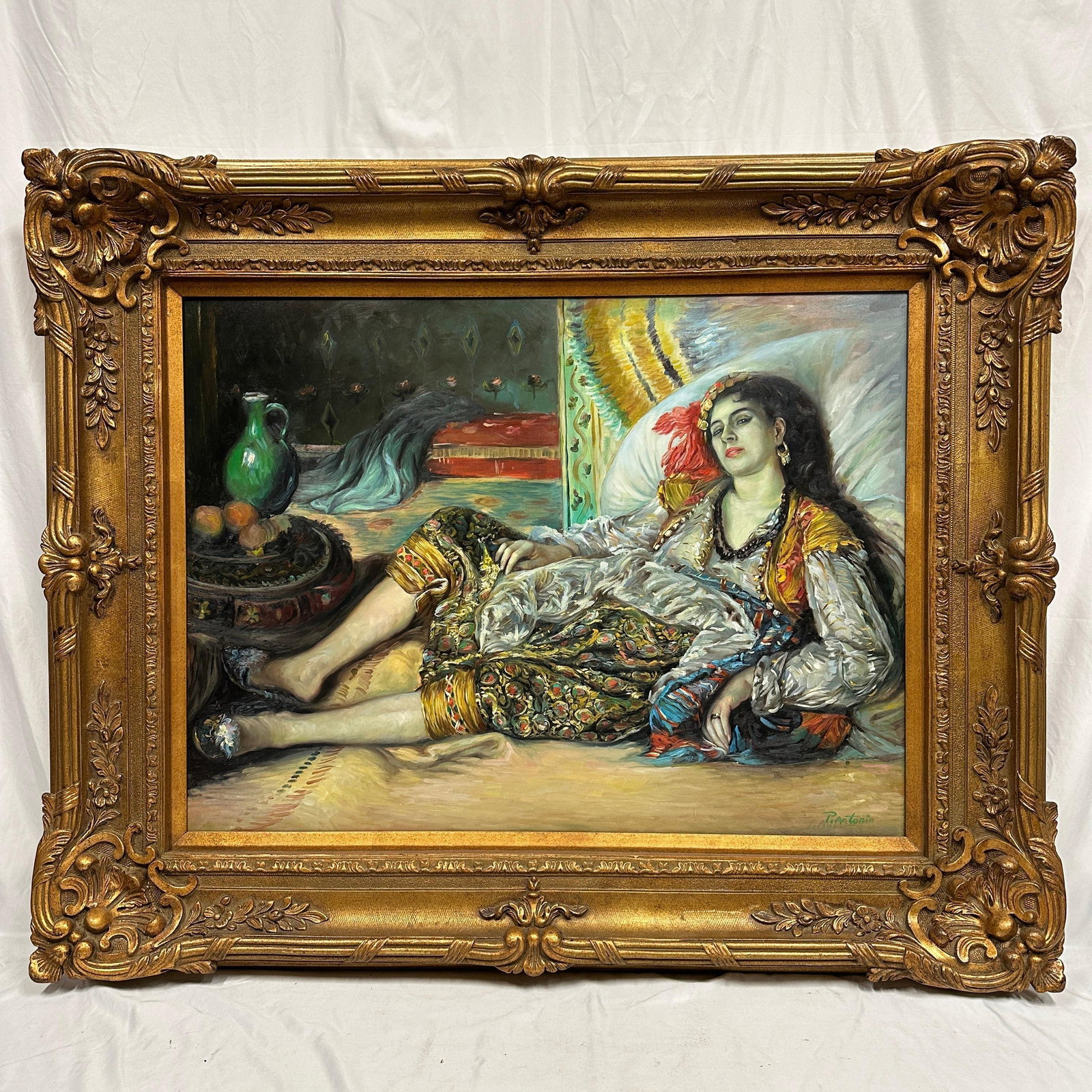 Hand Painted Algerian Woman In Style of Renoir Oil Painting Large Gold Ornate Gilt Frame R235: This is an artwork, a large after Pierre-Auguste Renoir, oil painting on canvas, depicting a reclining woman in colorful attire within an interior setting. Signed “P. Antonio” lower right. Pre