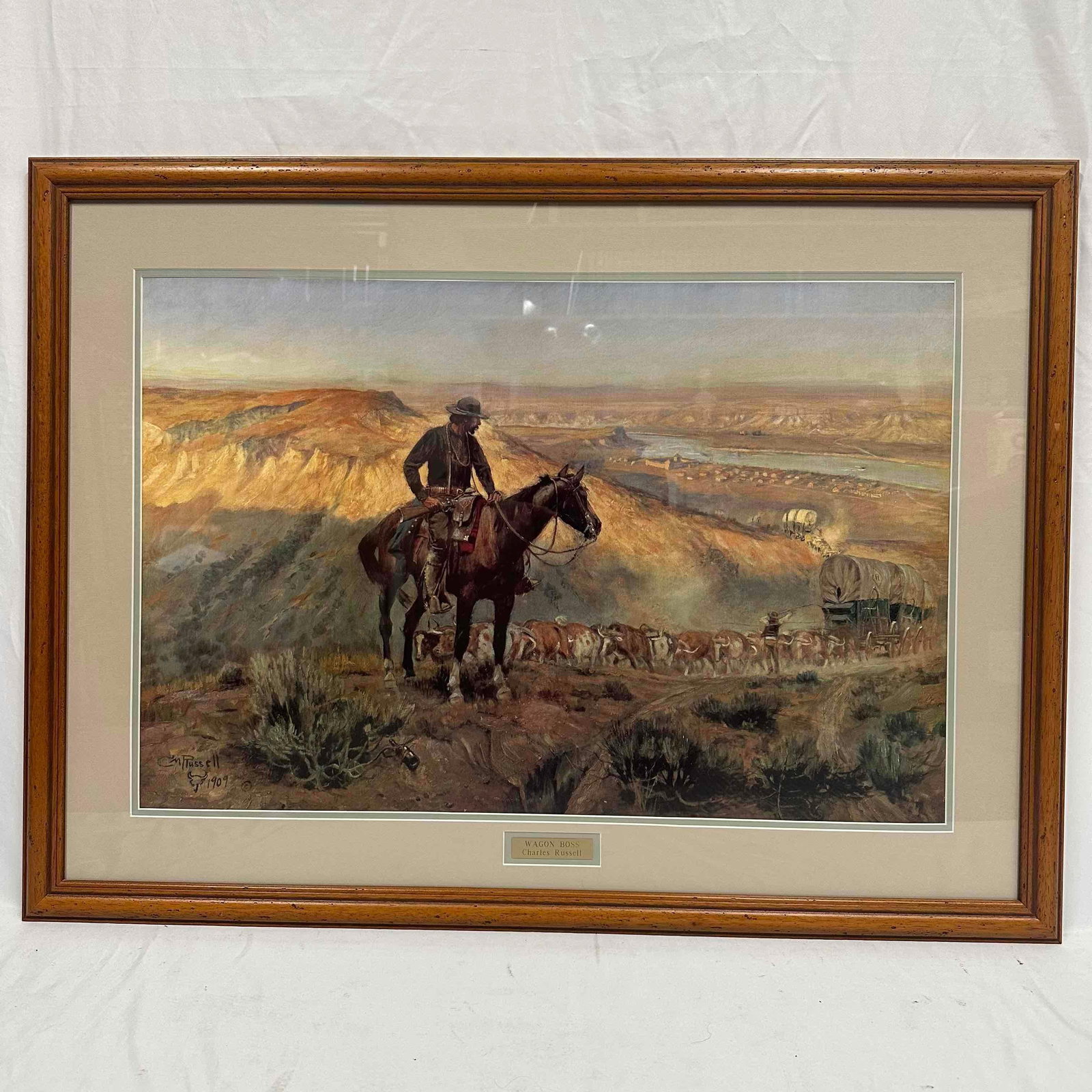 Charles Marion Russell Wagon Boss Framed Art Print R146: This framed art print is titled "Wagon Boss" by Charles M. Russell, dated 1909. This item is in pre-owned, previously displayed condition with normal light wear, and surface scratches. Please 