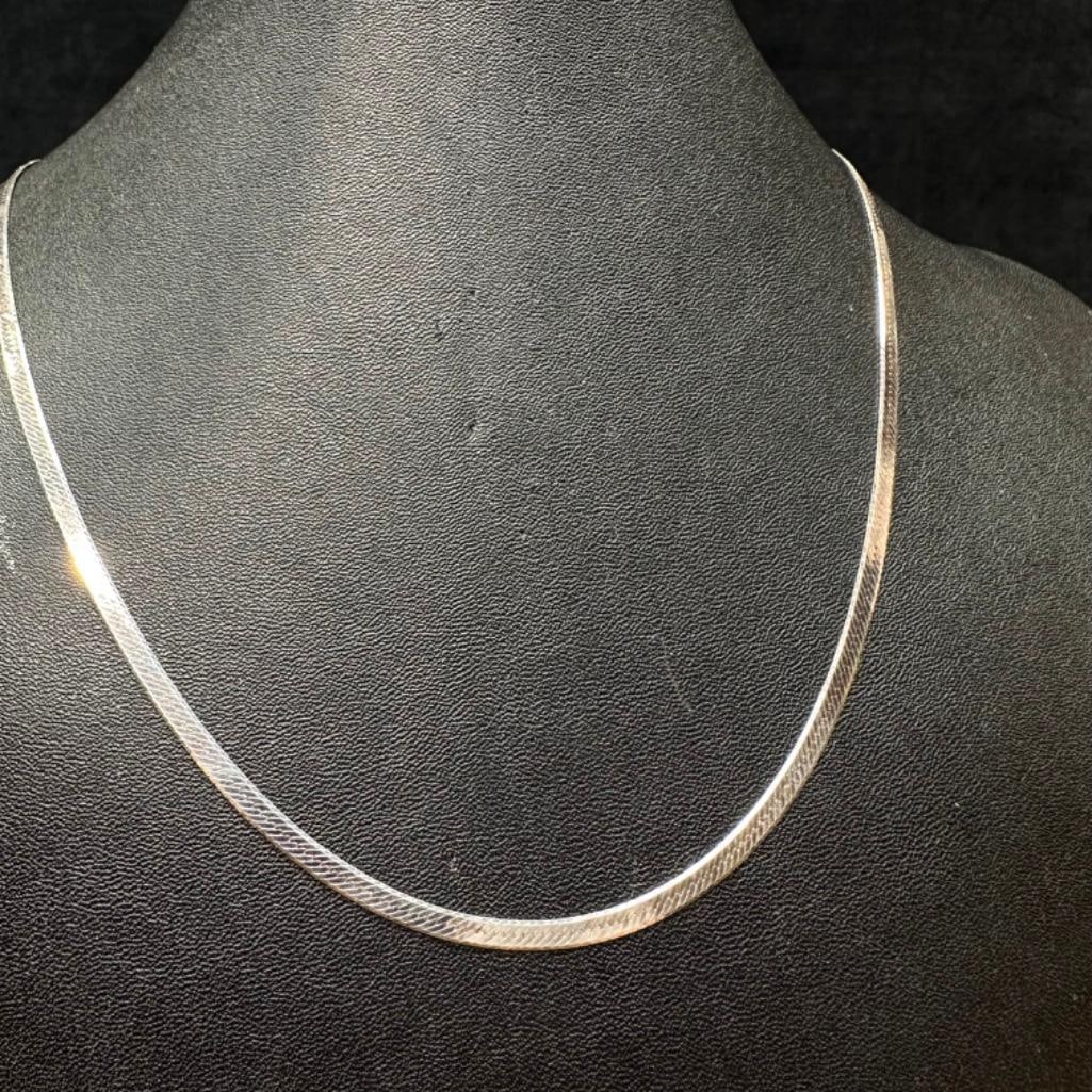 22" Sterling Herringbone Necklace: This piece of jewelry has been tested and researched prior to listing. Please view all our pictures they are part of our description. DETAILS: Metal - Sterling Silver Color - Silver Stones - none Hall