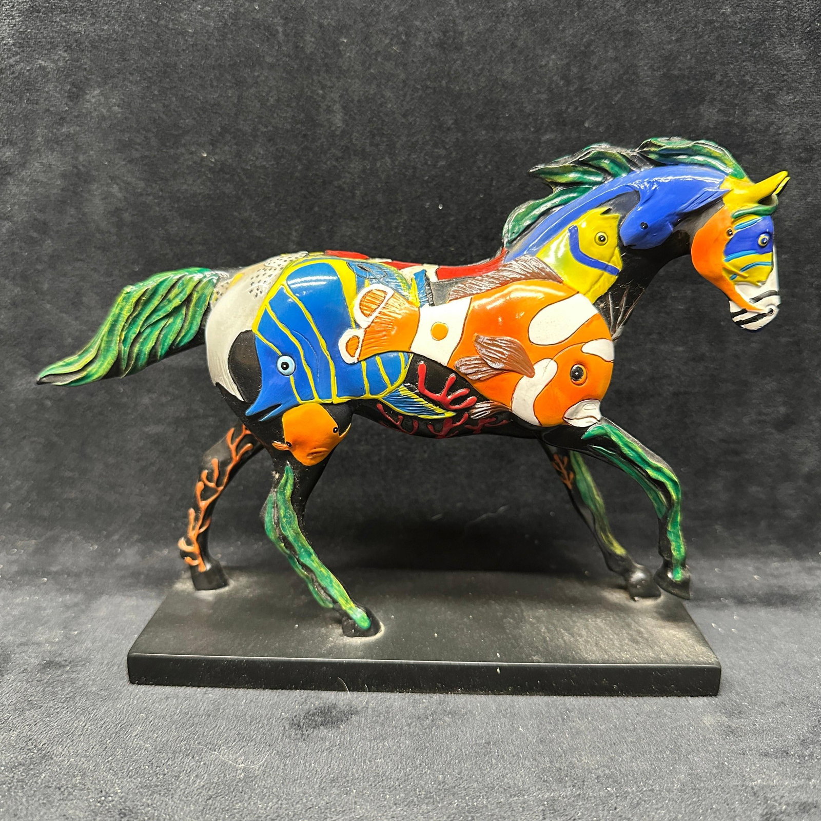The Trail Of Painted Ponies Tropical Reef Horse Figurine: Limited edition Tropical Reef Horse figurine from The Trail of Painted Ponies collection designed by artist Laurie Holman. Features brightly colored tropical fish and ocean themed decoration throughou
