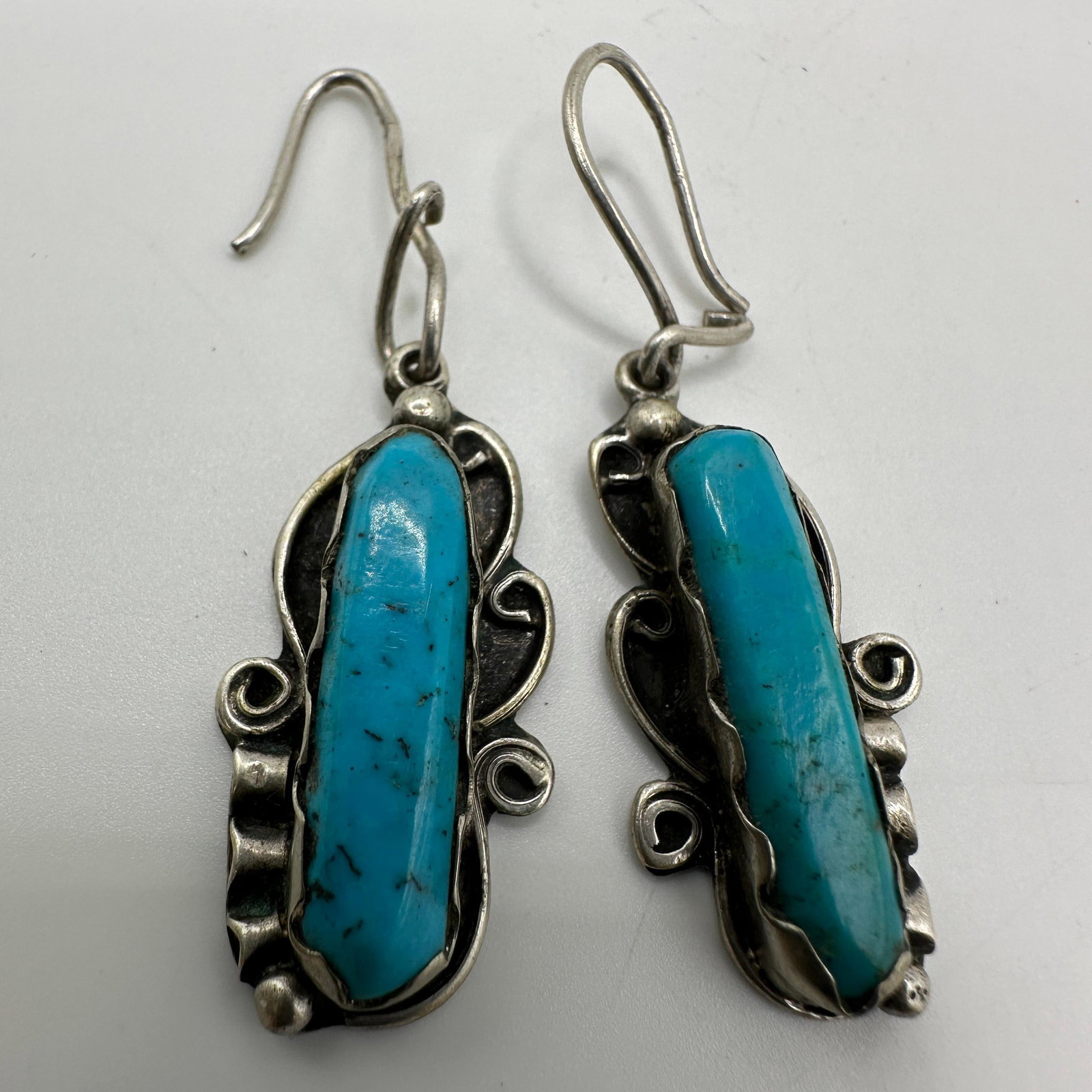 Natural Turquoise Elongated Stone Sterling Earrings: This item is in good pre-owned, previously used/displayed condition with noticeable light wear and surface scratches. Please reference all photos for full details. This piece of jewelry has been teste