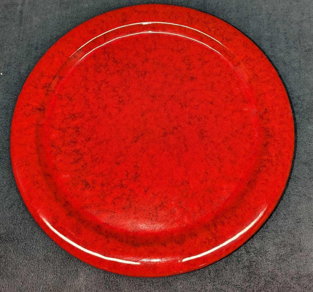 12" Handmade Red Ceramic Platter D: 12" Handmade Red Ceramic Platter D. This is approx 12" x 12" x 1" and it weighs 2.47 lbs. The platter has some light scratches. The bottom of the plate was signed by the artist.