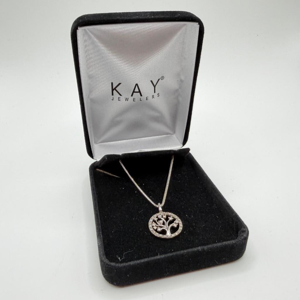 10k White Gold Diamond Tree Pendant: This piece of jewelry has been tested and researched prior to listing. Please view all our pictures they are part of our description. DETAILS: Metal - 10k Gold Color - Silver/White Gold Stones - Diamo