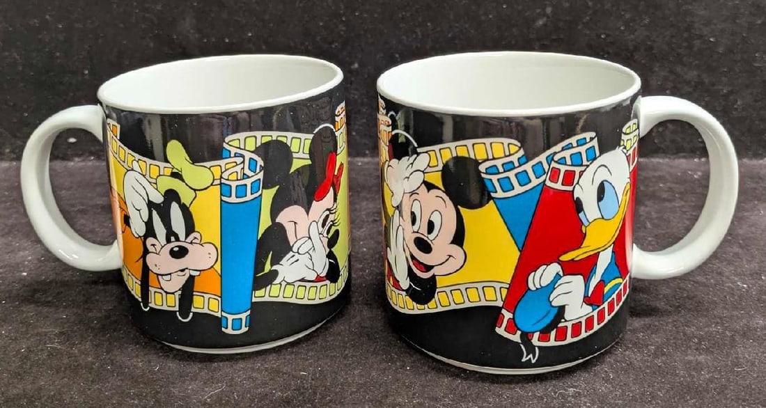 2 Disney Ceramic Strip Mugs With The Original Boxes: 2 Disney Ceramic Strip Mugs With The Original Boxes. Each mug comes in the original box that is approx 3 3/4" x 4 7/8" x 3 1/2" and the total weight is 1.55lb. The mugs do not appear to have been used