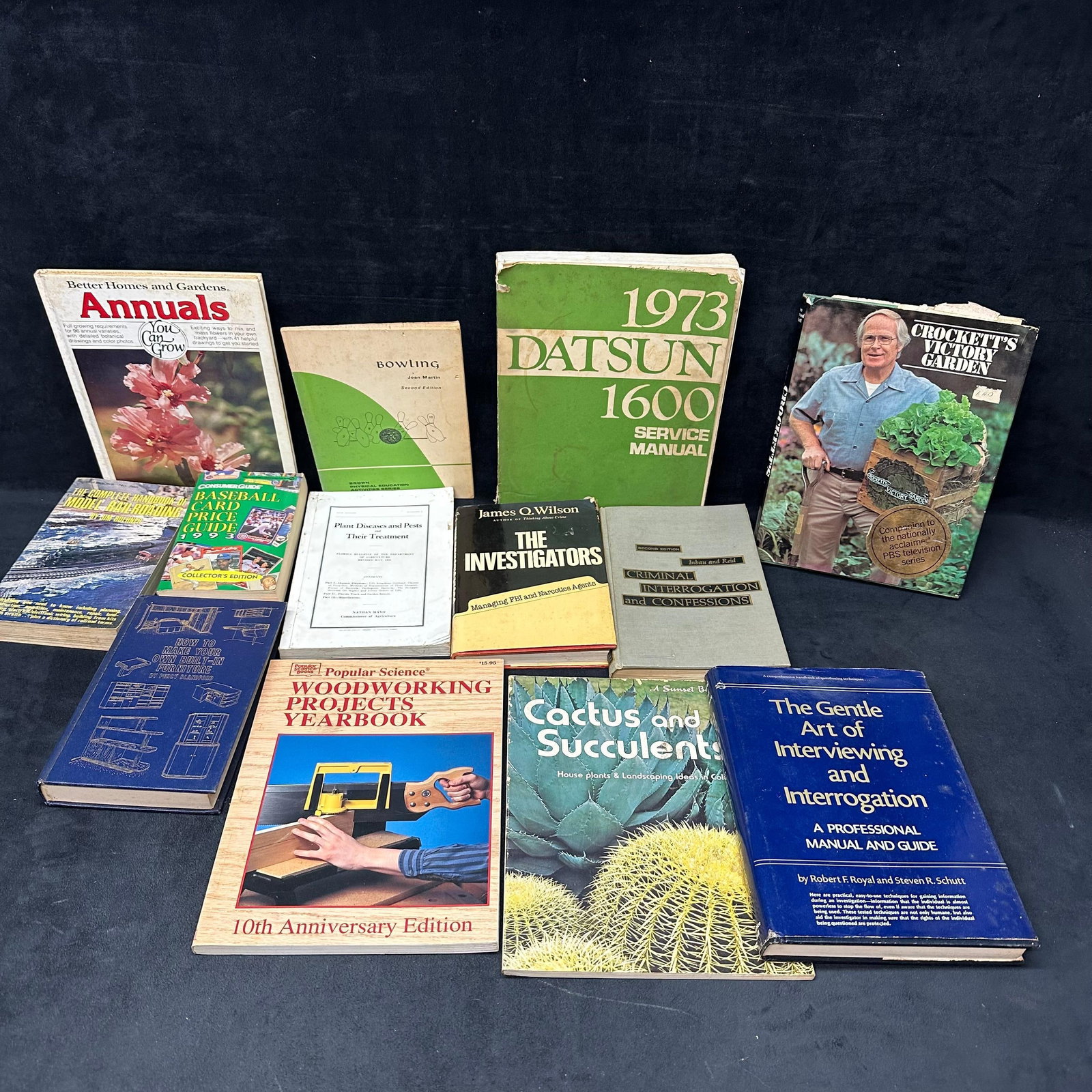 Mixed Book Lot Gardening Woodworking Railroading Interrogation Manuals Price Guides and More: A varied vintage book lot including topics such as gardening, annuals, cactus and succulents, woodworking project manuals, model railroading, plant disease guides, interrogation and investigator manua