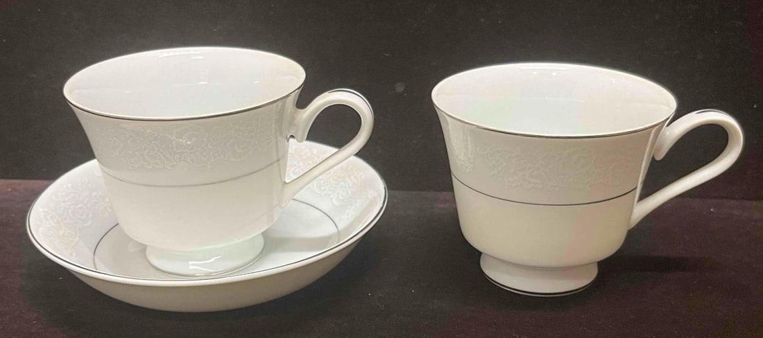 International Fine China 3011 Juliet Made In Japan One Saucer Two Mugs: This lot contains a International Fine China 3011 Juliet Made In Japan One Saucer Two Mugs. Each mug is approx 4 3/4" x 3 1/2" x 3" and the saucer is approx 5 3/4" x 5 3/4" x 1 1/4". Total weight is a