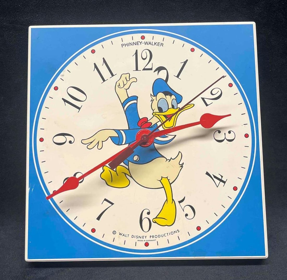 Vintage Phinney-Walker Walt Disney Productions Donald Duck Clock: This lot contains a Vintage Phinney-Walker Walt Disney Productions Donald Duck Clock. Made in Germany. It is approx 7 1/2" x 3/4" x 7 3/4". Total weight is approx 0.3lbs. Overall the Vintage