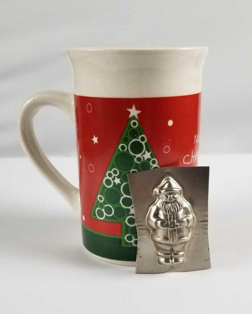Royal Norfolk Christmas Mug and Santa Chocolate Metal: This lot contains: 1- Royal Norfolk "Merry Christmas" coffee mug. Marked on the bottom, some of the maker stamp is gone. No known damages such as chips, cracks, or crazing. Approx. measures 3&