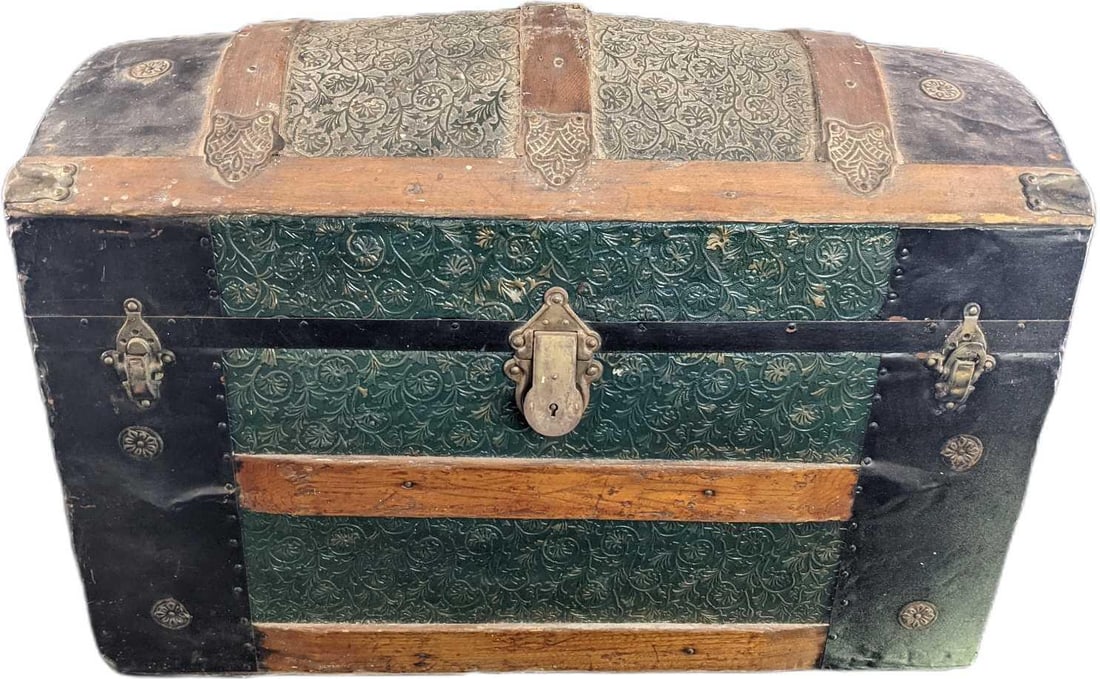 Antique Dome Top Steamer Trunk: This old chest has woodwork, iron fittings, tin metal plating, and metal roller wheels. The previous owner's great-grandmother used to take this on her adventures via stagecoach. The chest is approx 3