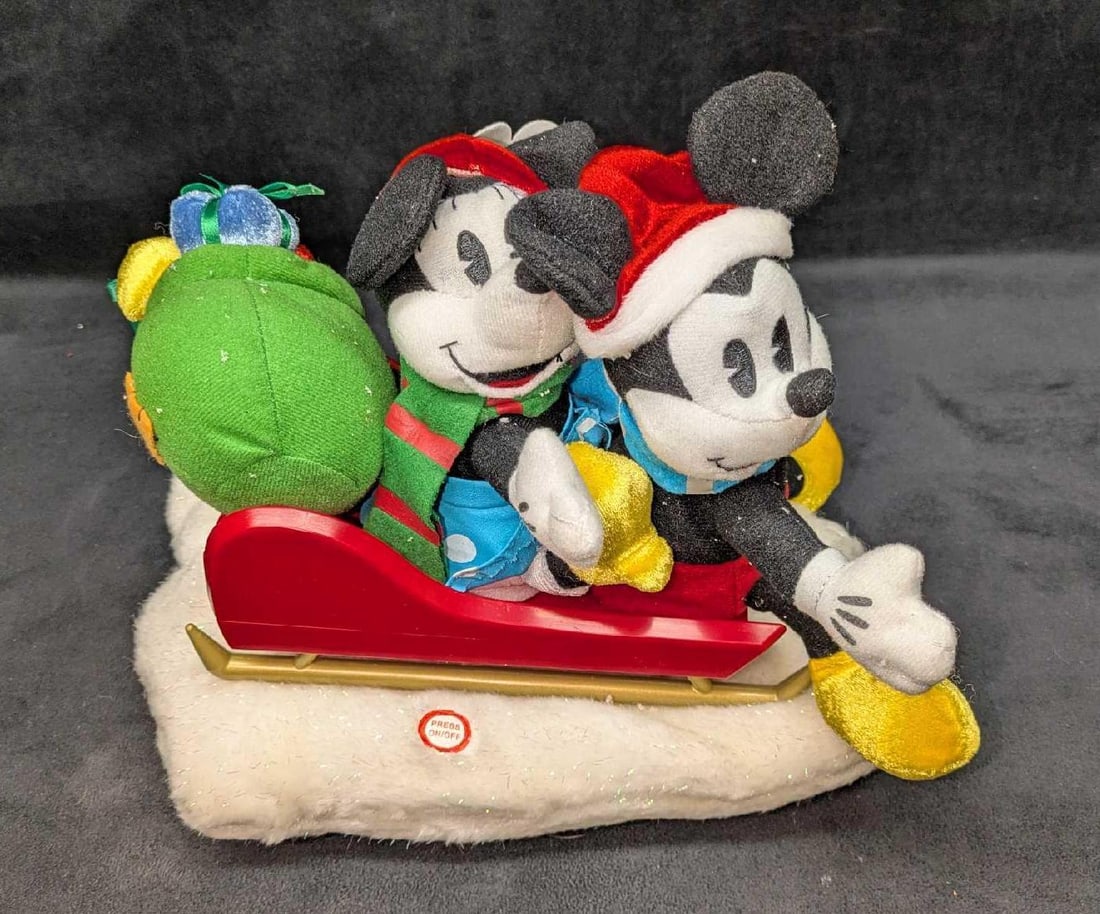 Gemmy Disney Mickey And Minnie Mouse Christmas Animated Musical Plush: Gemmy Disney Mickey And Minnie Mouse Christmas Animated Musical Plush. Mickey and Minnie sing "Here Comes Santa Claus" and move when they sing. This was tested and it works. The pair have some fake Ch