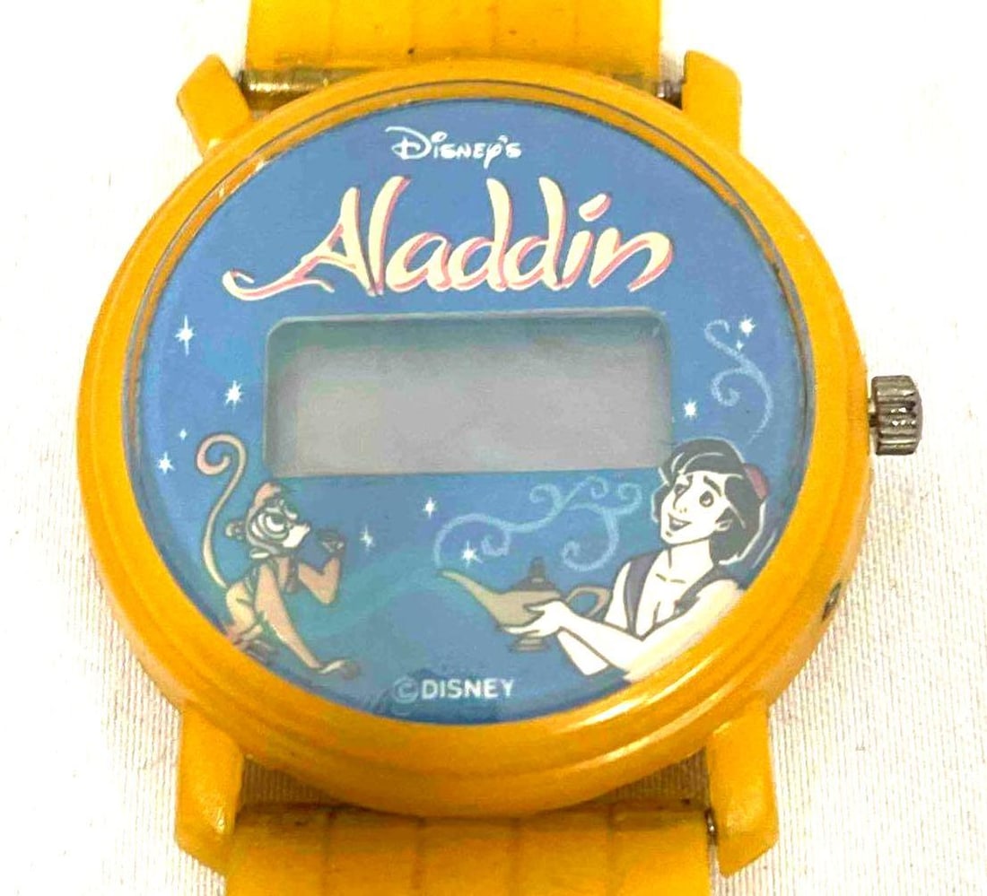 Vintage Disney Yellow Aladdin Hologram Watch: This lot contains a Vintage Disney Yellow Aladdin Hologram Watch. It is approx 8 1/4" x 1 1/4" and it weighs about 0.02lbs. Overall the Disney Watch is in good used condition with some light wear from