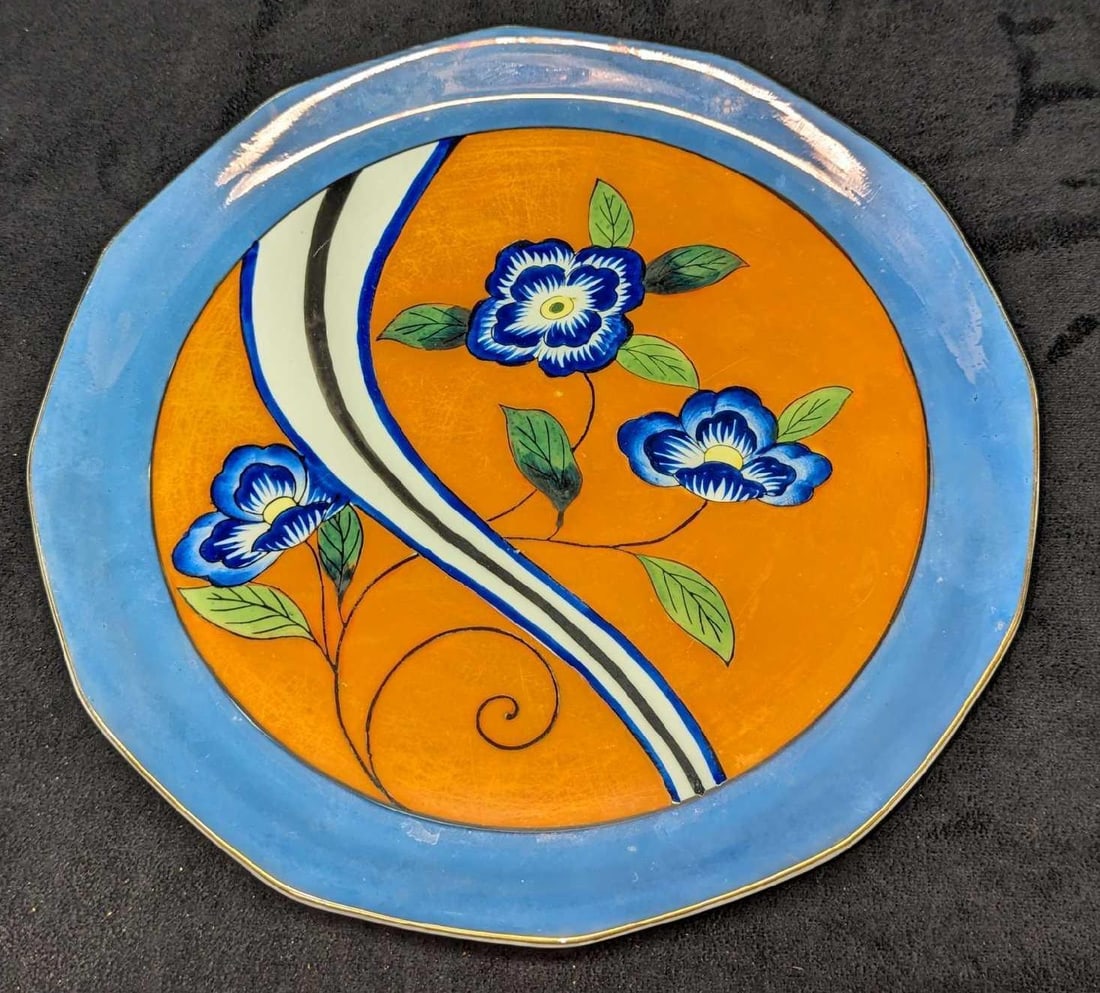 Vintage Japanese China Glossy Flower Plate: Vintage Japanese China Glossy Flower Plate. The hand painted plate is approx 10 3/4" x 10 3/4" x 1" and it weighs 1.48lb. This decorative plate has some dimples, scratches and a very small chip on the