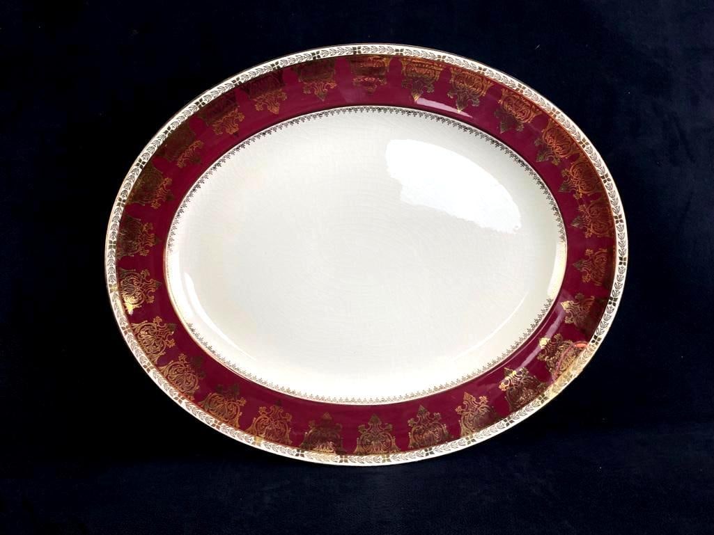 Fine Porcelain Crown Ducal Platter in Burgundy: Fine Porcelain Crown Ducal Platter in Burgundy Fine Vintage Crown Ducal Porcelain Dinnerware in Burgundy, Marked; this lot includes 1 oval serving platter measuring 10" x 12 1/2". Has an