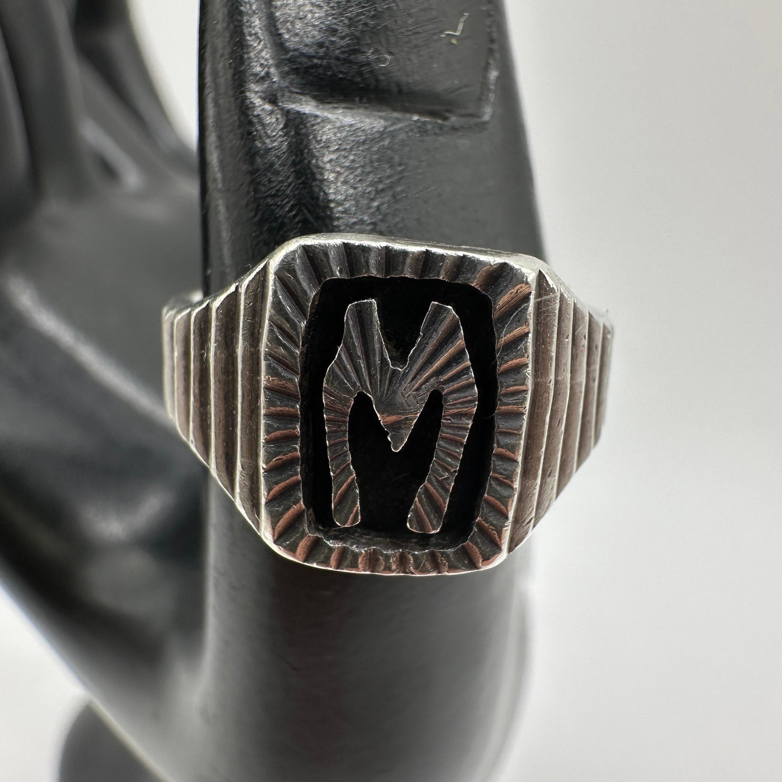 Textured M Monogram Symbol Sterling Silver Ring 925: This item is in good pre-owned, previously used/displayed condition with noticeable light wear and surface scratches. Please reference all photos for full details. This piece of jewelry has been teste