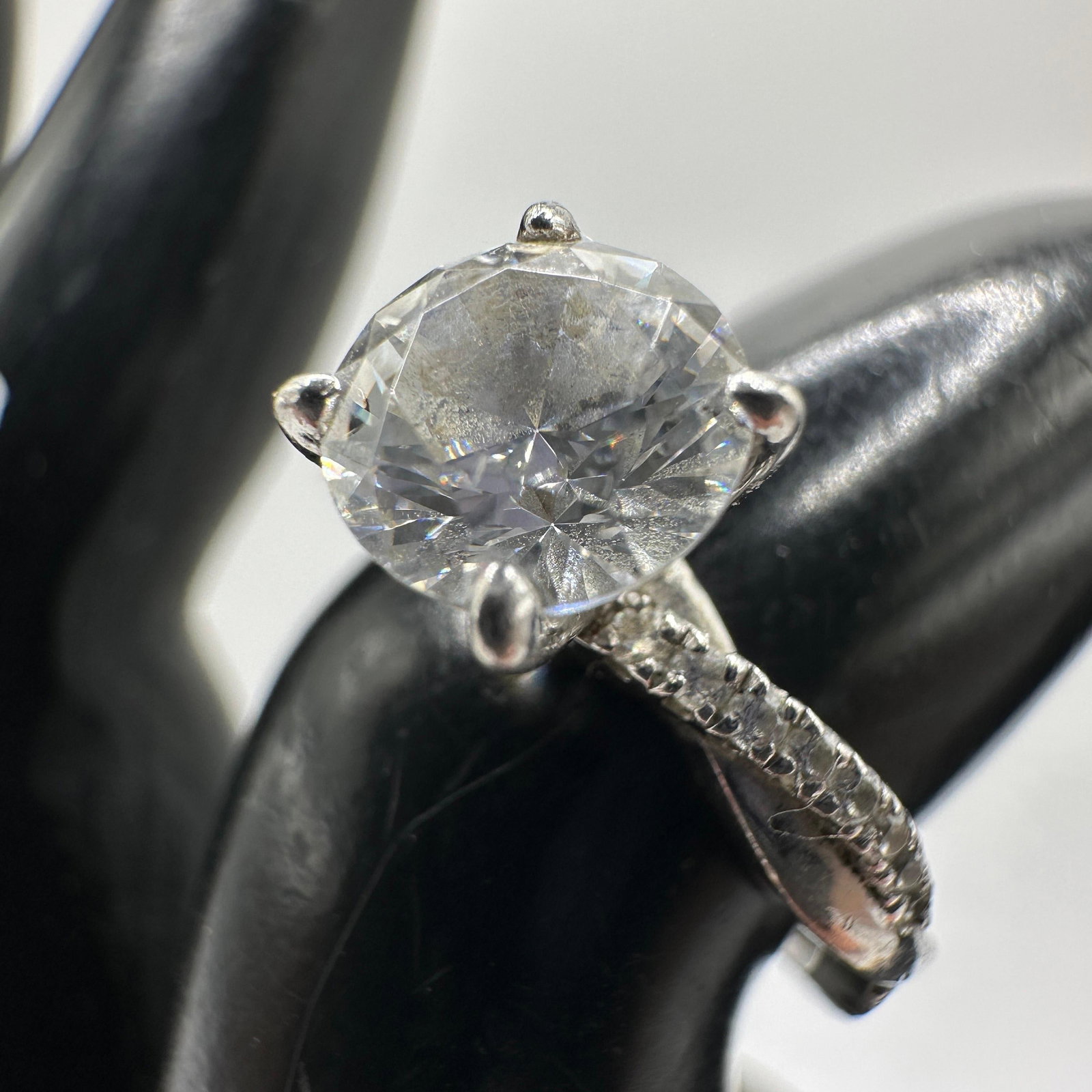 925 Sterling CZ Round Studded Engagement Ring: This item is in good pre-owned, previously used/displayed condition with noticeable light wear and surface scratches. Please reference all photos for full details. This piece of jewelry has been teste