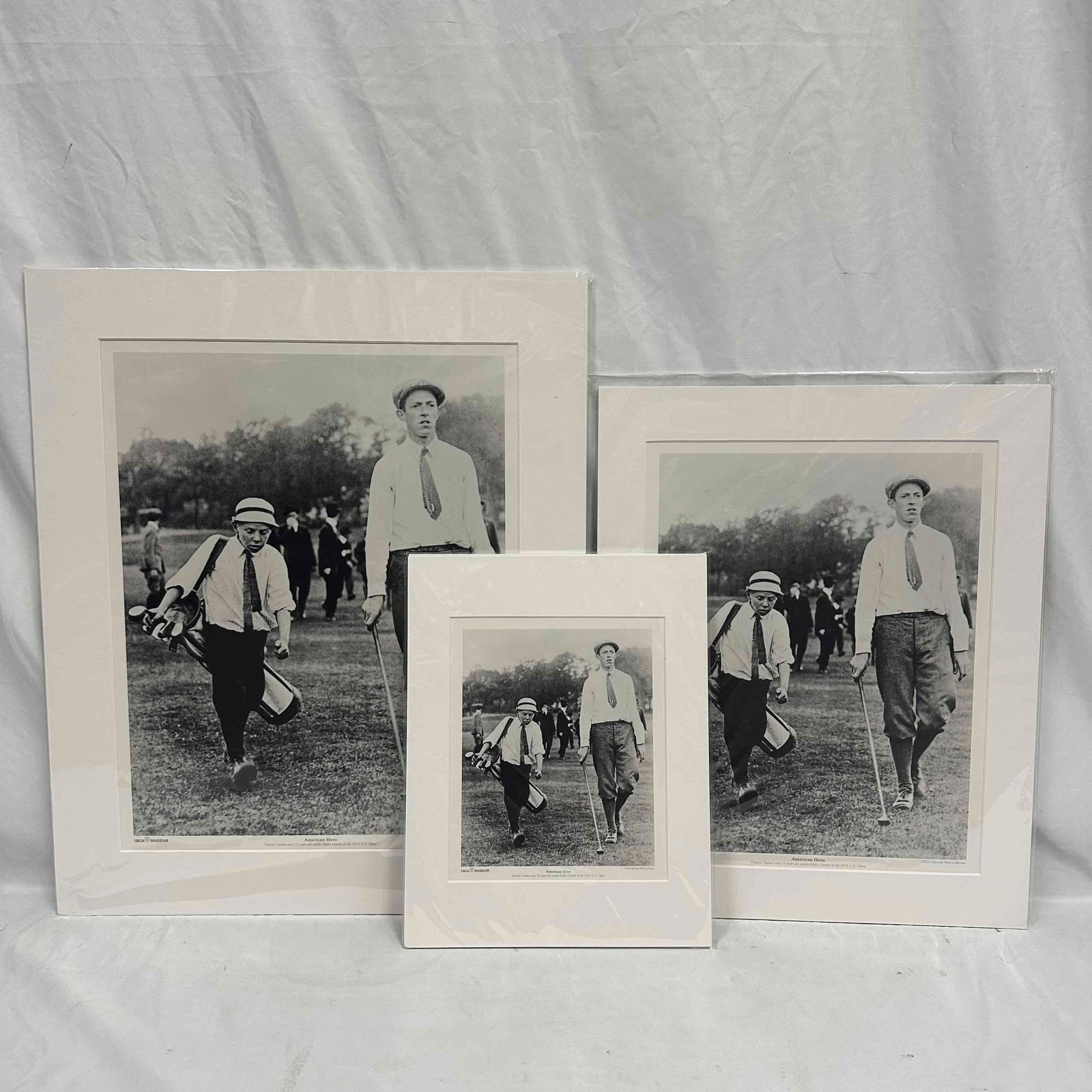 Francis Ouimet and Eddie Lowery American Hero USGA Museum Prints Set of Three: Set of three matted black-and-white prints of Francis Ouimet and 10-year-old caddie Eddie Lowery after their legendary 1913 U.S. Open victory. Produced by the USGA Museum Photo Collection. Includes tw