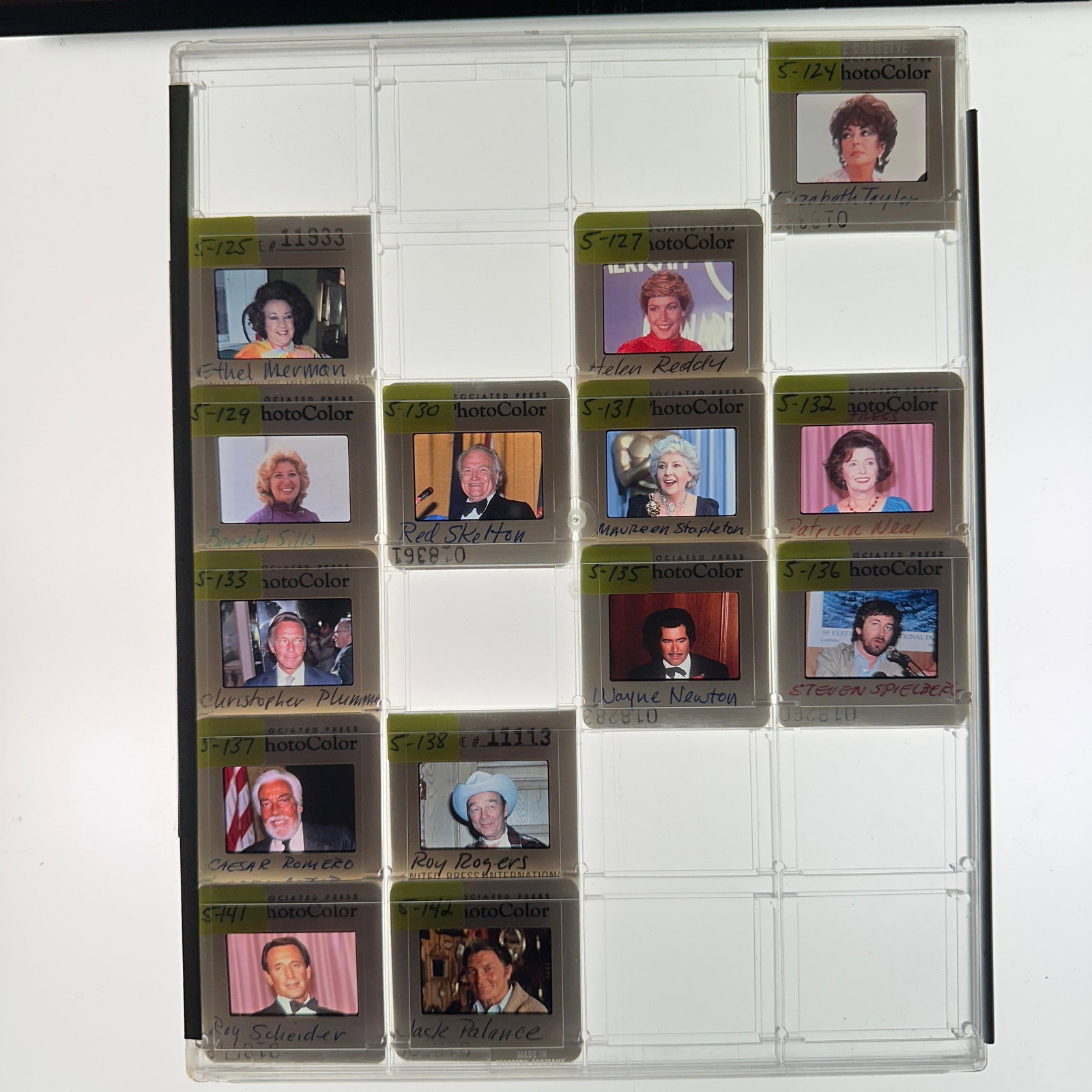 Collection of Celebrity and Entertainment Press Photo Slides Elizabeth Taylor Steven Spielberg: Group of vintage Associated Press and United Press International color press slides featuring notable actors, entertainers, directors, and television personalities. Includes identified examples such