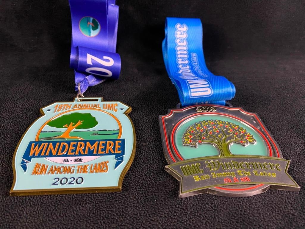 Pair of Windermere Run Among the Lakes Medals JB: Pair of Windermere Run Among the Lakes Medals Finisher medals from two years of the "Run Among the Lakes" 10k/5k in Windermere, Florida. The medals feature colorful designs, cool shapes, and