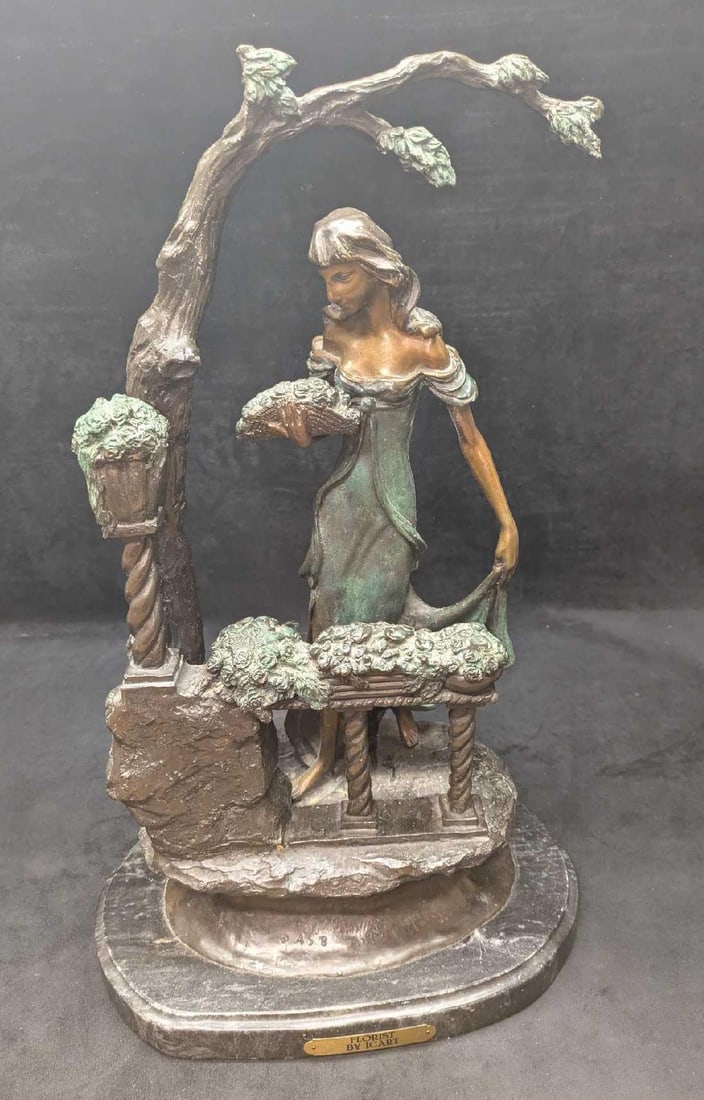 Vintage Bronze After Louis Justin Icart Florist Sculpture: Vintage Bronze After Louis Justin Icart Florist Sculpture. This is approx 14" x 8" x 24" and it weighs 45lbs. Is marked ASB. The statue has some markings from use and age. Please see the images as